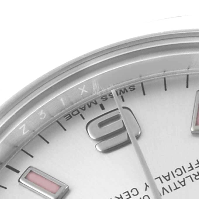 The image shows a close-up of the Rolex Mid-Size 177200 Women's Stainless Steel Silver Dial watch face, highlighting the dial, bezel, and hour markers.