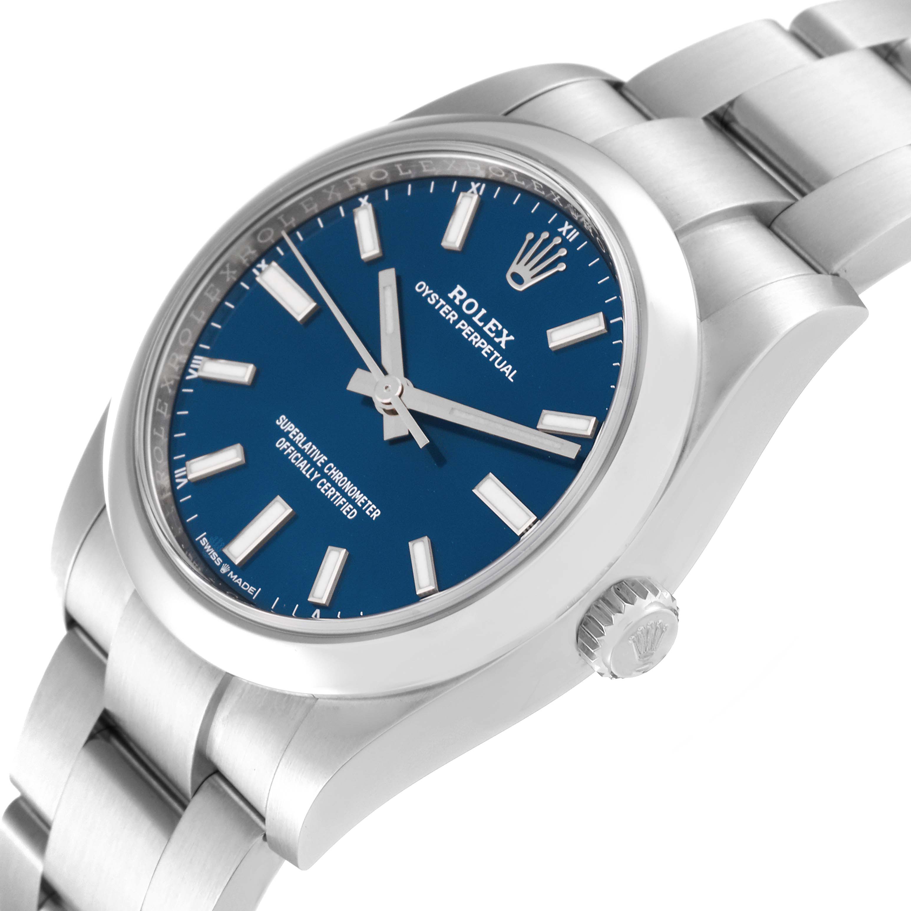 The image shows a close-up, angled view of a Rolex Oyster Perpetual 124200 Men
s Stainless Steel Blue Dial 124200 Men
s Stainless Steel Blue Dial watch, highlighting the face, crown, and bracelet.