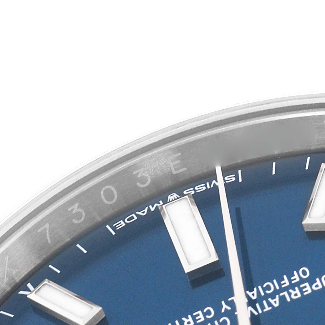 The image shows a close-up of the dial and bezel of a Rolex Oyster Perpetual 124200 Men
s Stainless Steel Blue Dial 124200 Men
s Stainless Steel Blue Dial watch, focusing on the watch face and "Swiss Made" text.