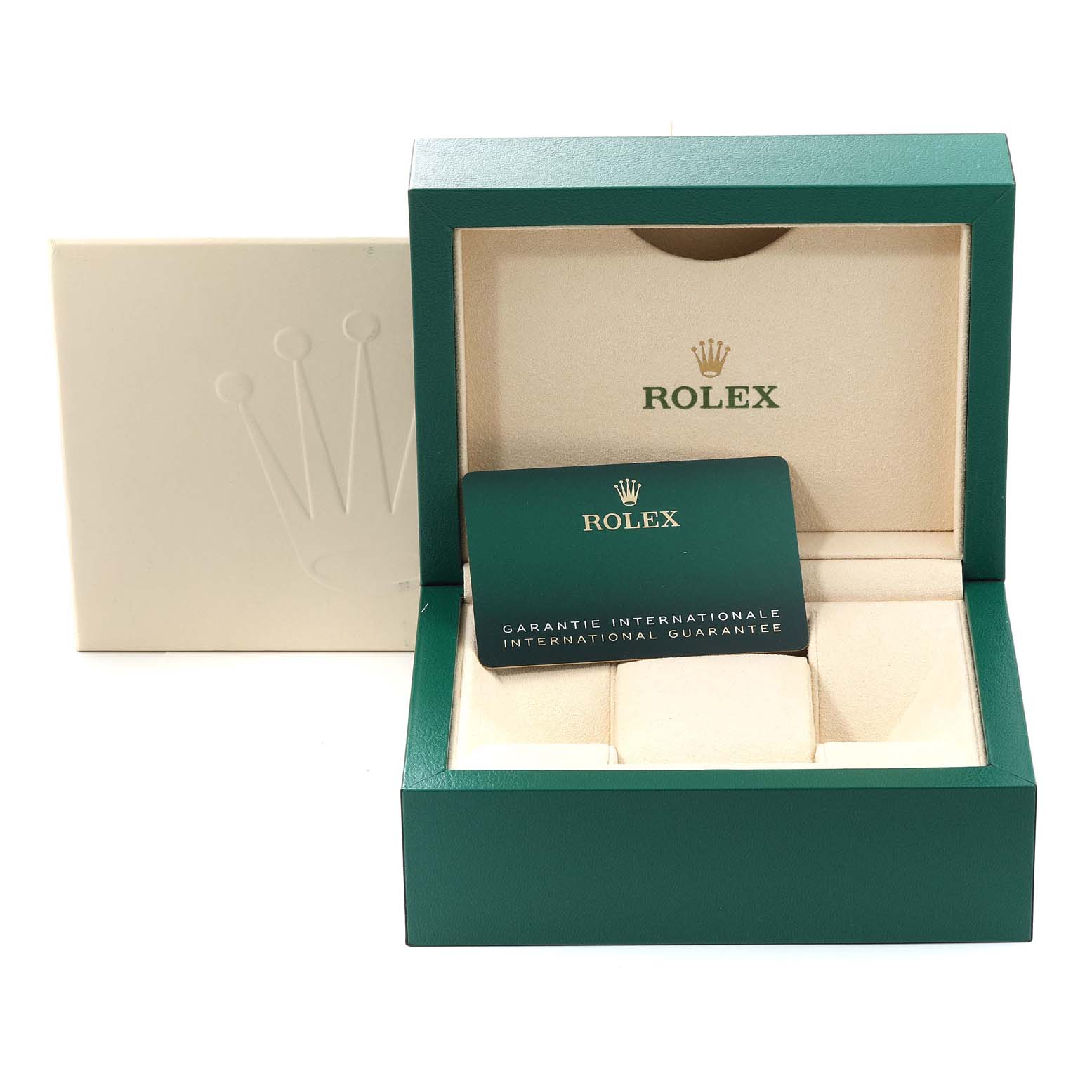 The image shows an open green Rolex box for the Oyster Perpetual model, displaying the international guarantee card.