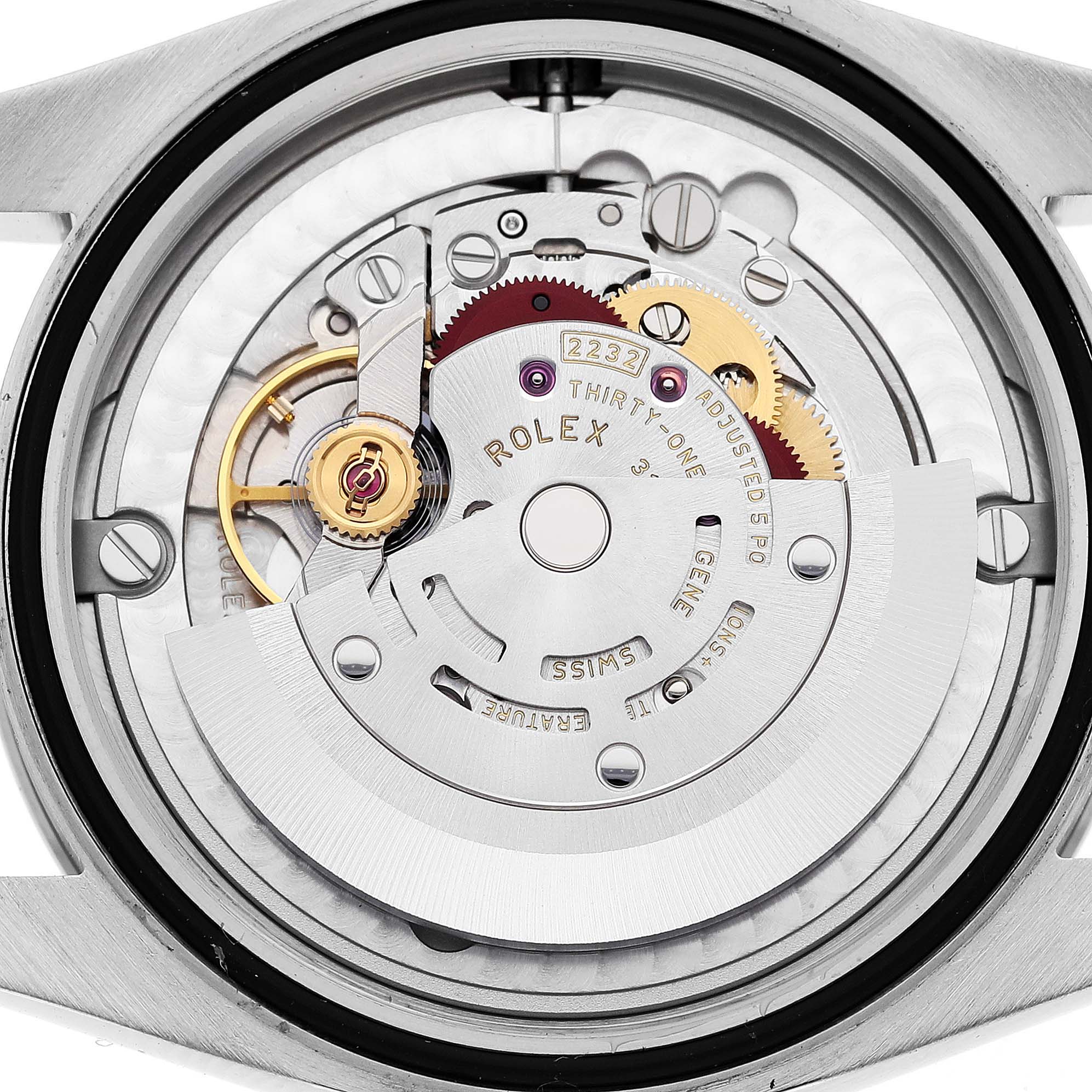 The image shows the back angle of a Rolex Oyster Perpetual 124200 Men
s Stainless Steel Silver Dial 124200 Men
s Stainless Steel Silver Dial watch, highlighting its internal movement components.