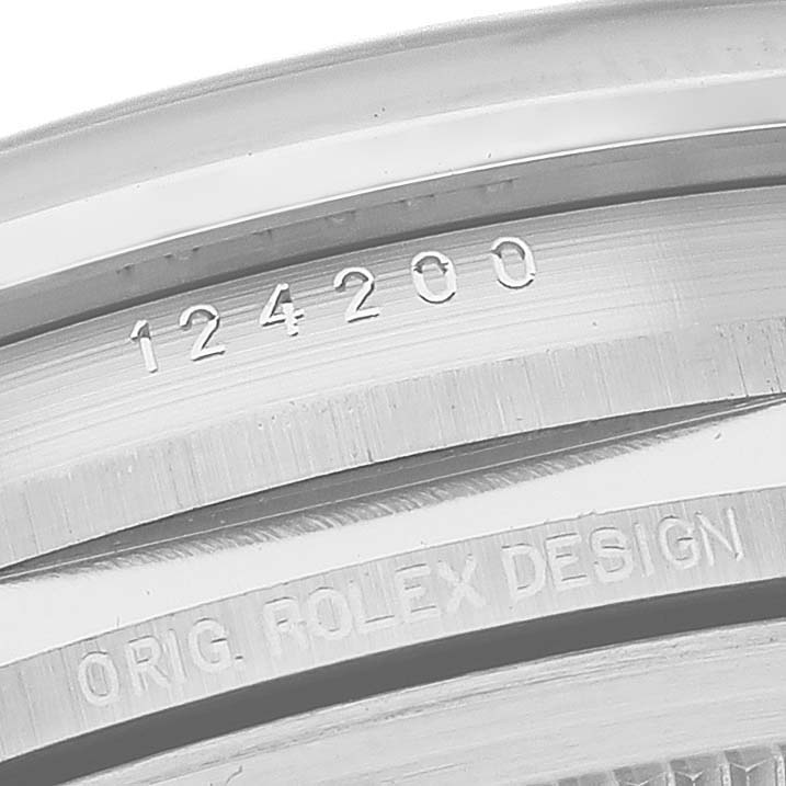 This close-up shows the model number and design engraving of the Rolex Oyster Perpetual 124200 Men
s Stainless Steel Silver Dial 124200 Men
s Stainless Steel Silver Dial.
