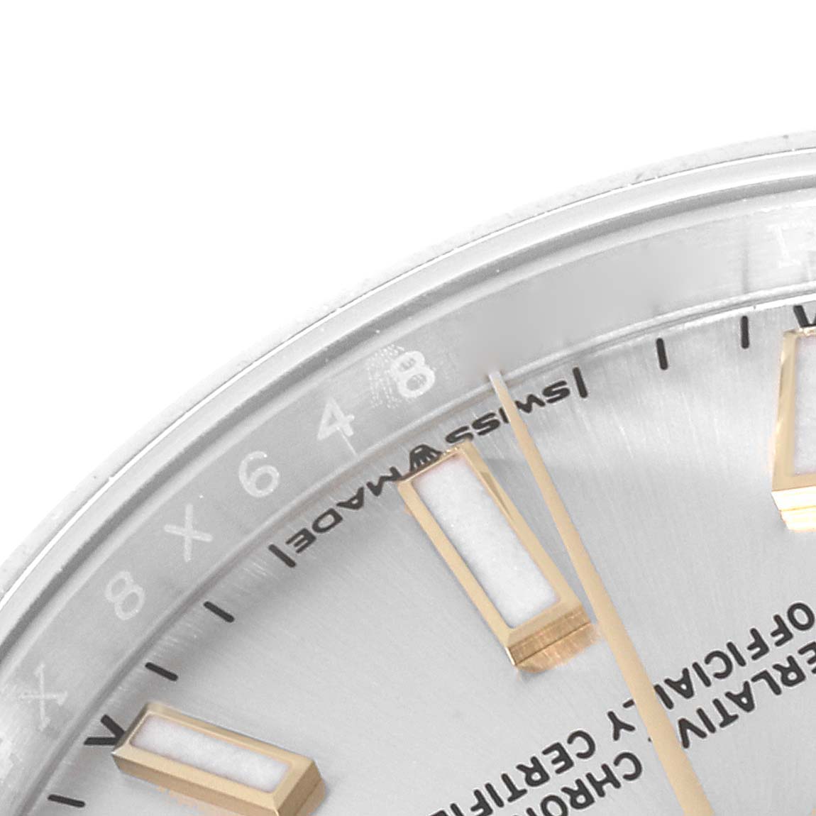 This close-up angle of a Rolex Oyster Perpetual 124200 Men's Stainless Steel Silver Dial 124200 Men's Stainless Steel Silver Dial watch shows part of the dial, hour markers, and the "Swiss Made" text.