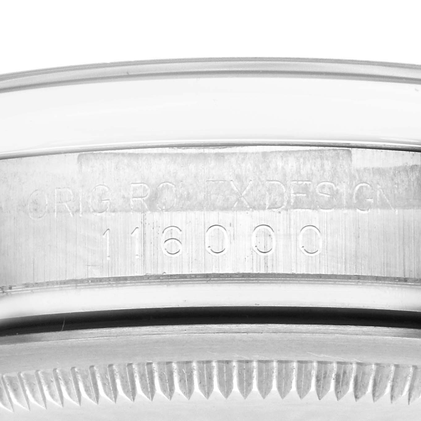 The image shows a close-up of the side engraving on a Rolex Oyster Perpetual 116000 Men's Stainless Steel Silver Dial 116000 Men's Stainless Steel Silver Dial watch case.