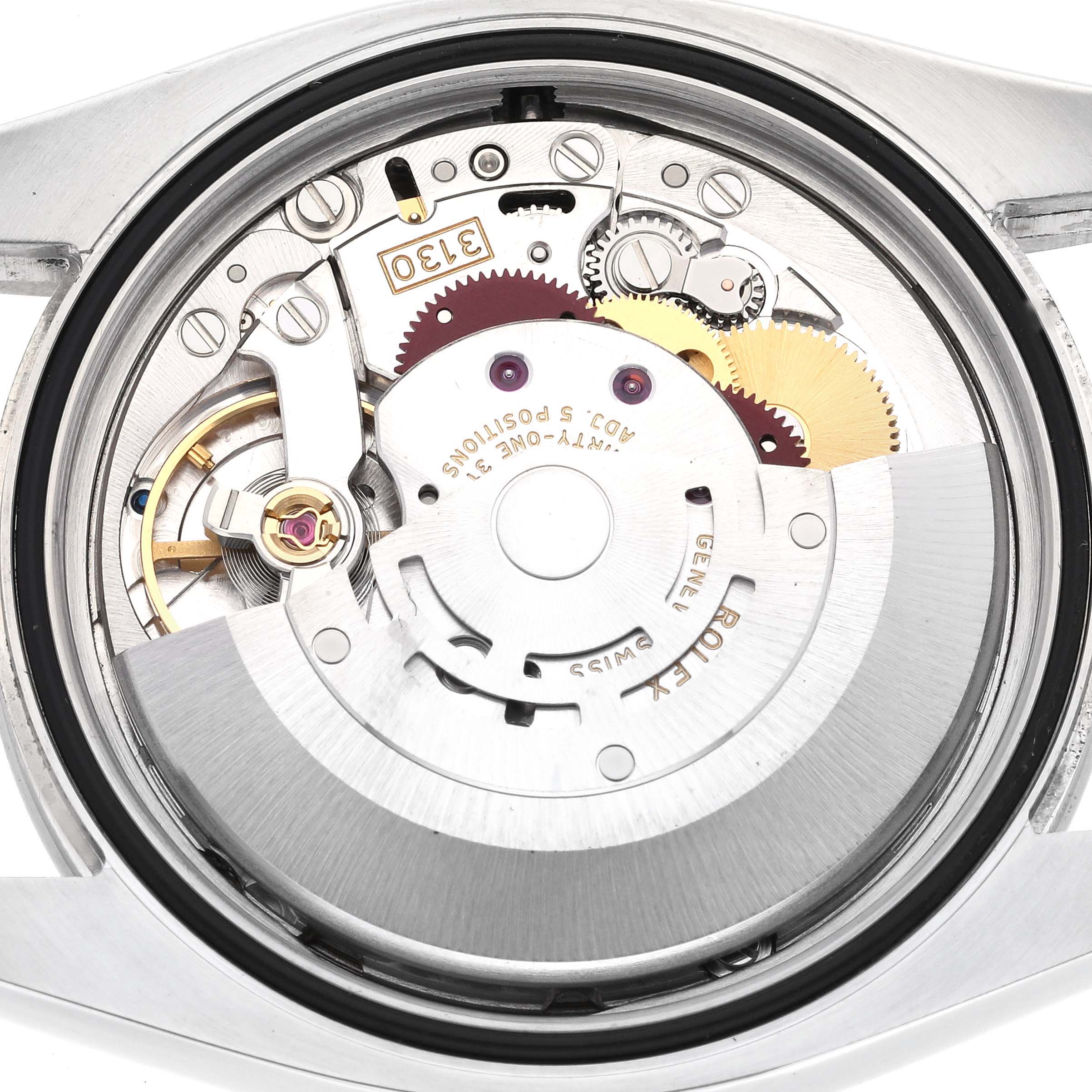 This image shows the Rolex Oyster Perpetual 116000 Men's Stainless Steel Silver Dial 116000 Men's Stainless Steel Silver Dial watch's movement from a top-down view, highlighting its internal mechanical components.