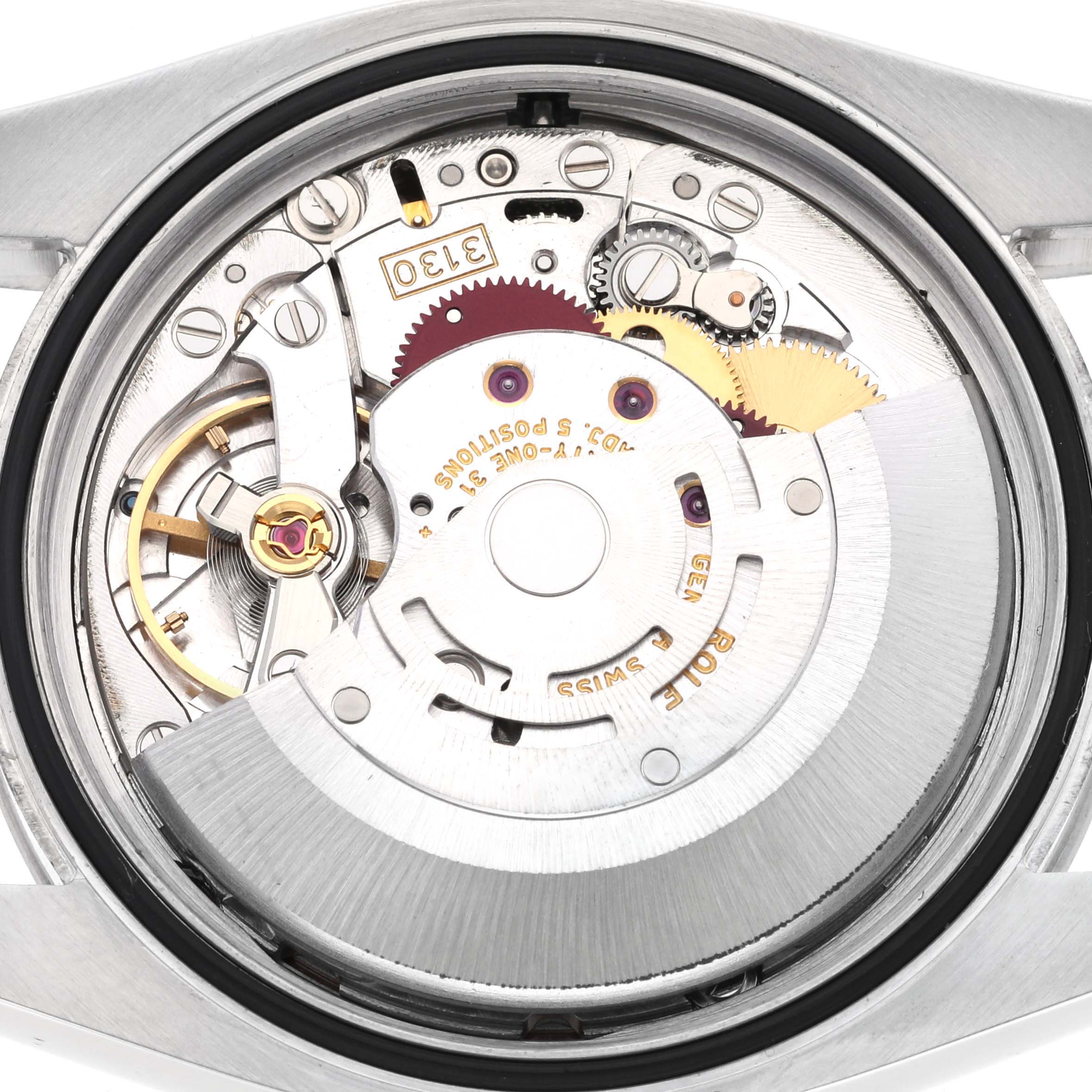 The image shows the back view of a Rolex Oyster Perpetual 116034 Men's Stainless Steel Pink Dial 116034 Men's Stainless Steel Pink Dial watch, highlighting its mechanical movement.