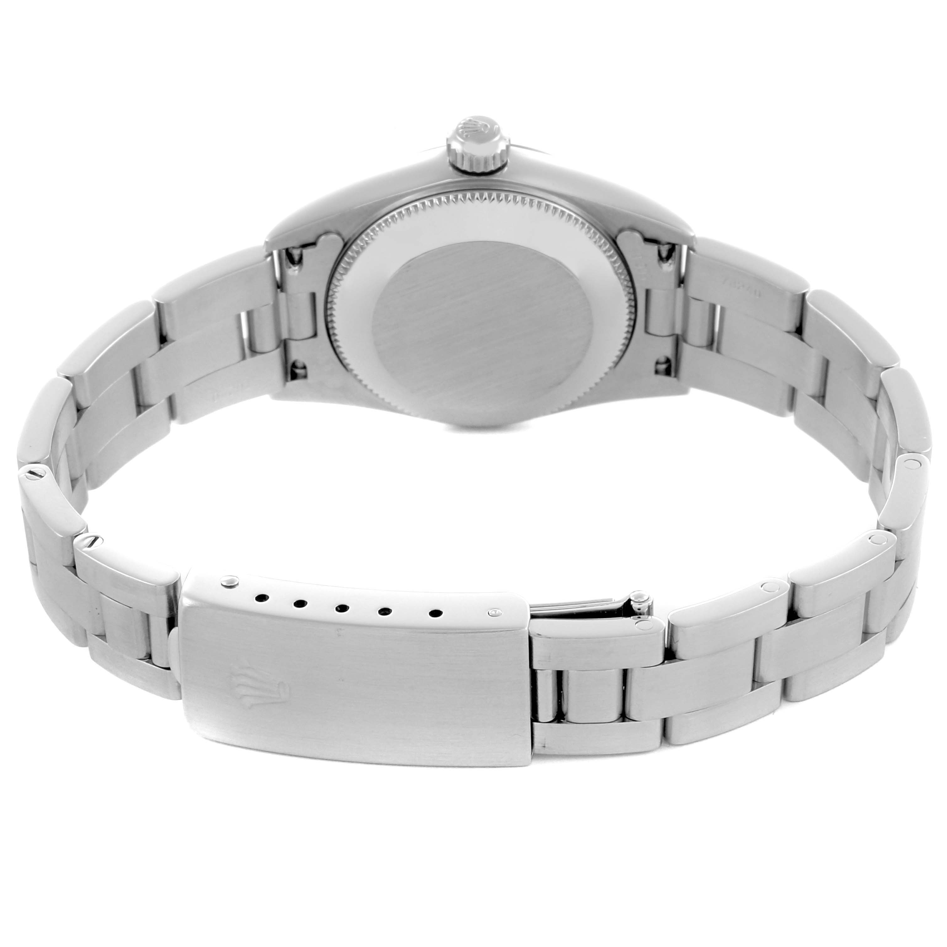 The Rolex Oyster Perpetual 76080 Women's Stainless Steel Black Dial 76080 Women's Stainless Steel Black Dial watch is shown from the back, displaying its case back and bracelet with a clasp.