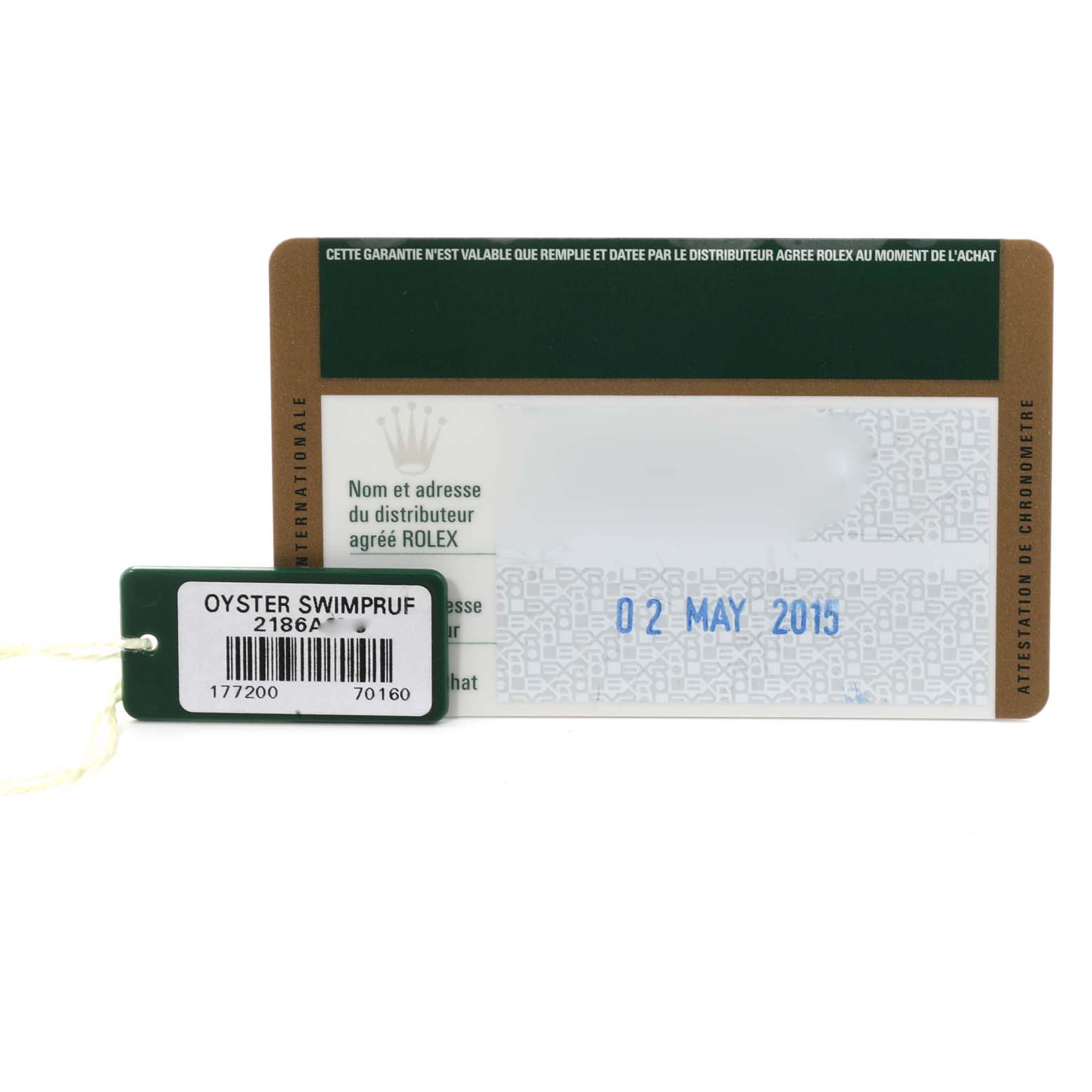 The image shows a Rolex warranty card and a tag for the Mid-Size model watch, both displayed flat.