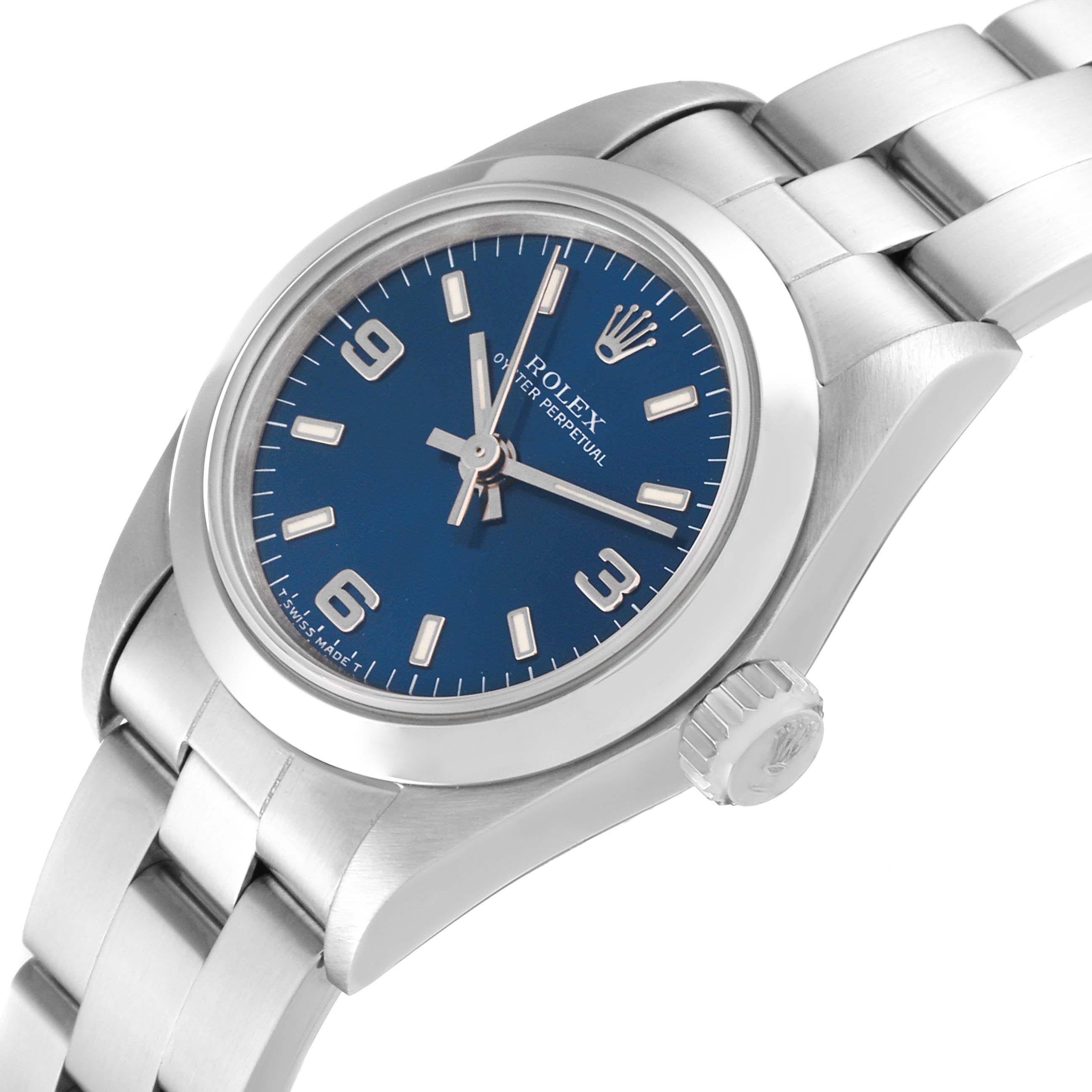 The image shows a close-up angle of the Rolex Oyster Perpetual 67180 Women's Stainless Steel Blue Dial 67180 Women's Stainless Steel Blue Dial watch, highlighting its blue dial, silver indices, and metal bracelet.