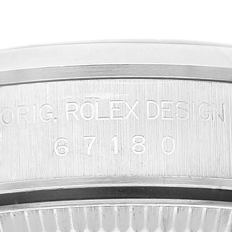 This image shows a close-up of the case side of a Rolex Oyster Perpetual 67180 Women's Stainless Steel Blue Dial 67180 Women's Stainless Steel Blue Dial watch, displaying its design number.