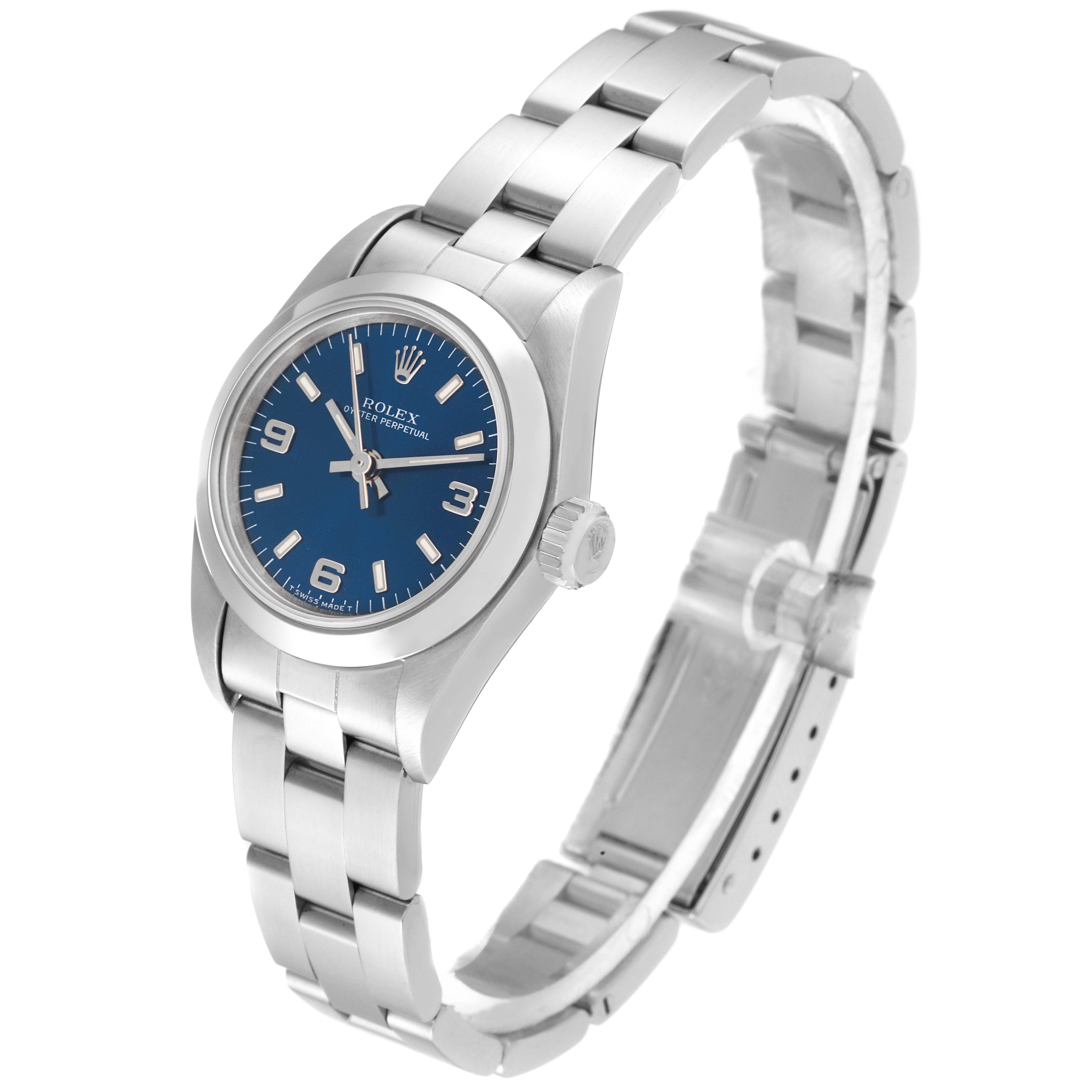 The image shows a side view of the Rolex Oyster Perpetual 67180 Women's Stainless Steel Blue Dial 67180 Women's Stainless Steel Blue Dial watch highlighting the blue dial, case, crown, and bracelet.