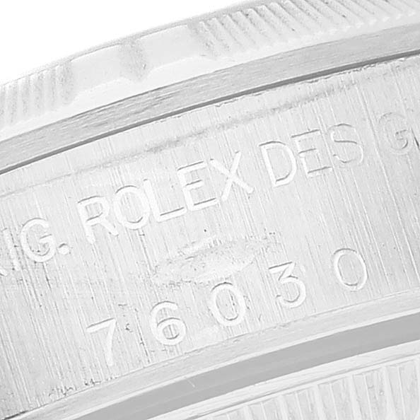 This close-up shows the engraved bezel and part of the case of the Rolex Oyster Perpetual 76030 Women
s Stainless Steel Pink Dial 76030 Women
s Stainless Steel Pink Dial model.