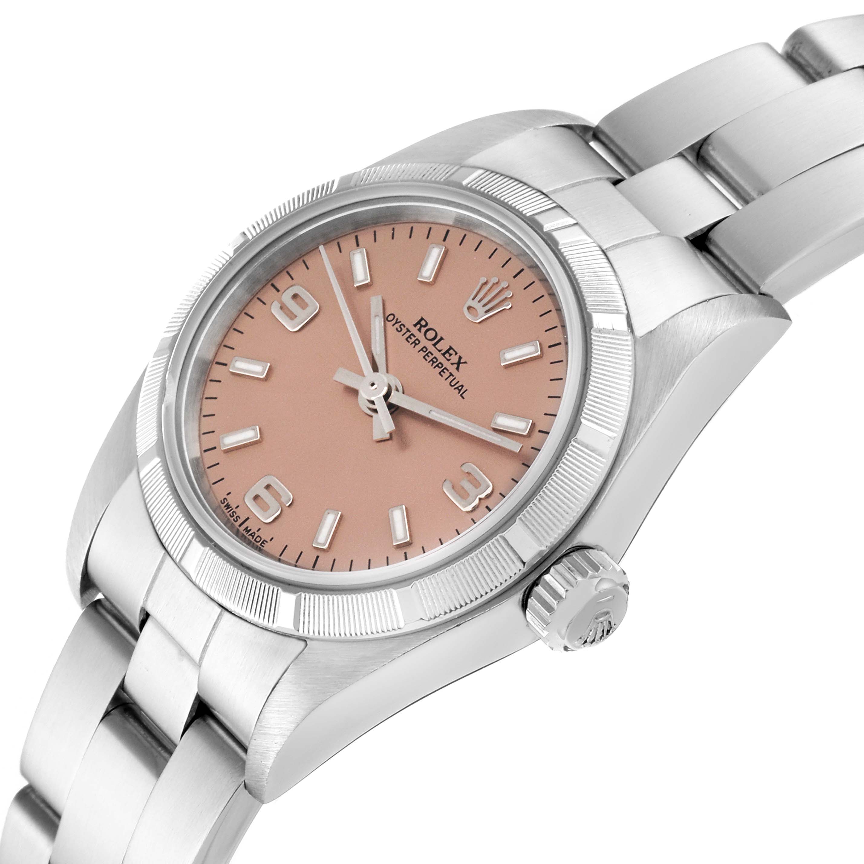 This Rolex Oyster Perpetual 76030 Women
s Stainless Steel Pink Dial 76030 Women
s Stainless Steel Pink Dial watch is angled showing the dial, bezel, crown, and part of the bracelet.