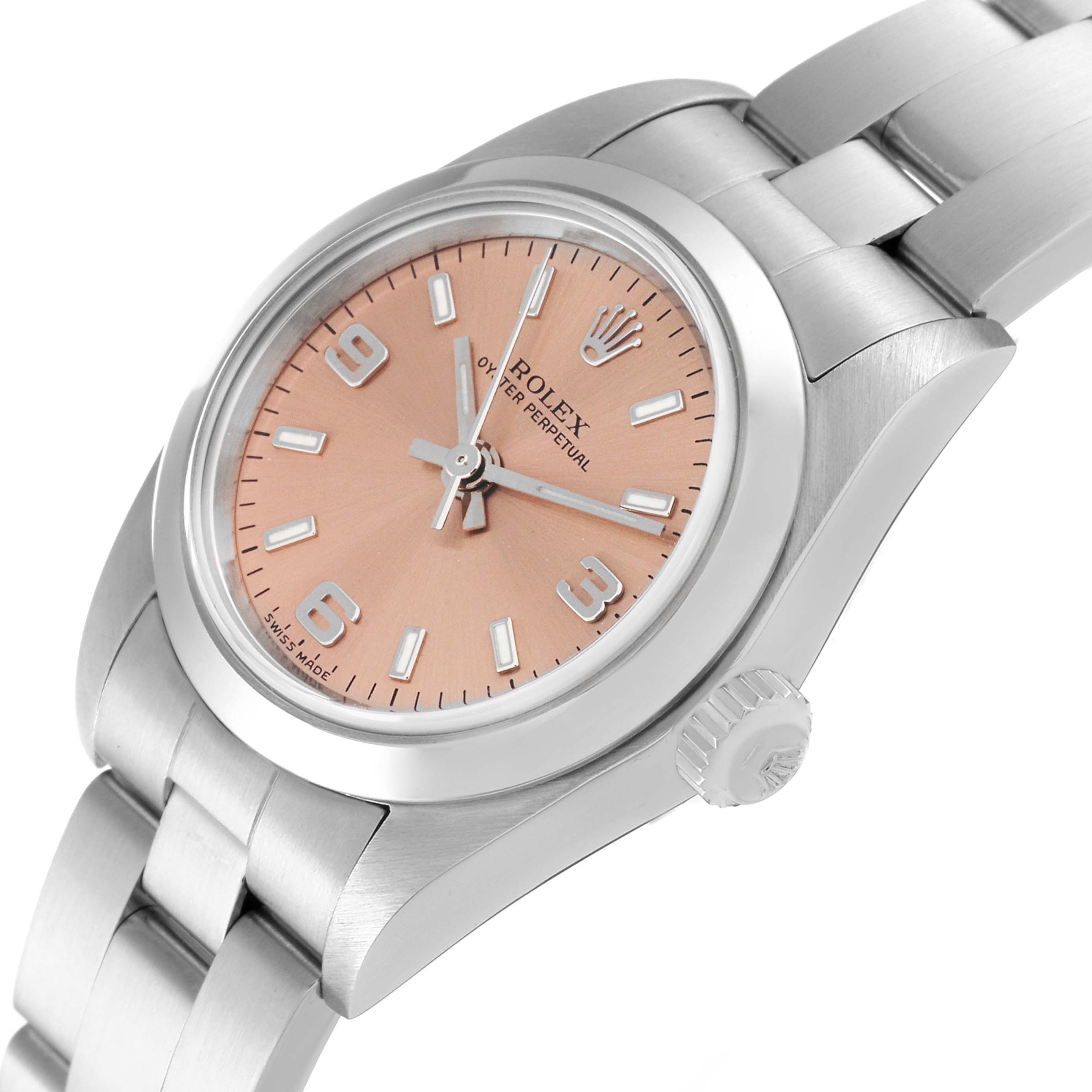 The image shows a close-up, angled view of a Rolex Oyster Perpetual 76080 Women's Stainless Steel Orange Dial 76080 Women's Stainless Steel Orange Dial watch featuring the case, dial, crown, and part of the bracelet.