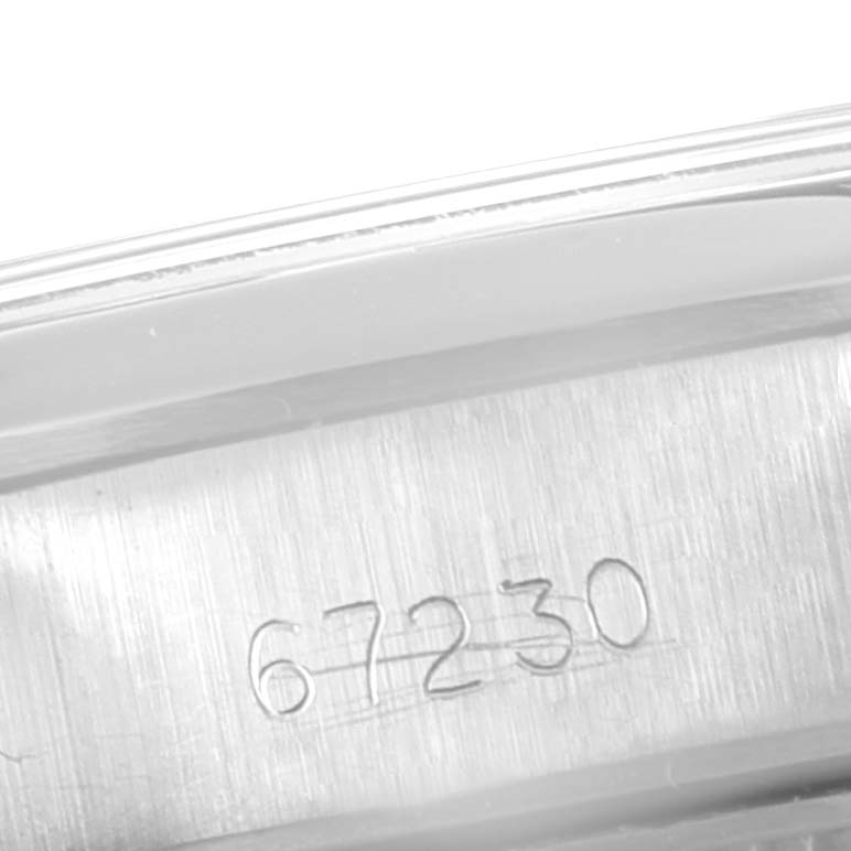 The image shows a close-up of the reference number '67230' on the case of a Rolex Oyster Perpetual 67230 Women's Stainless Steel Silver Dial 67230 Women's Stainless Steel Silver Dial watch.