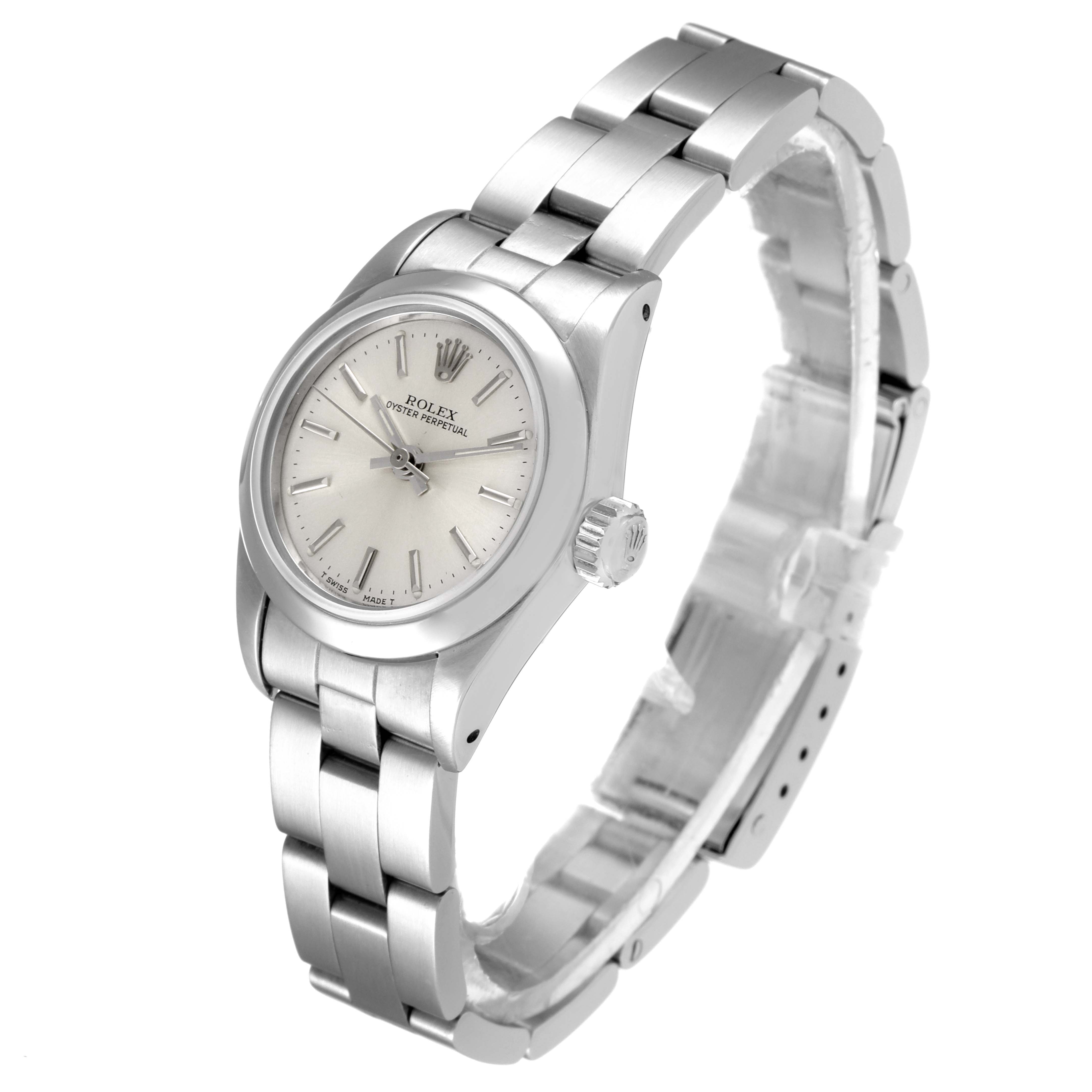 This image shows a Rolex Oyster Perpetual 67230 Women's Stainless Steel Silver Dial 67230 Women's Stainless Steel Silver Dial watch from a three-quarter angle emphasizing the case, dial, and bracelet.