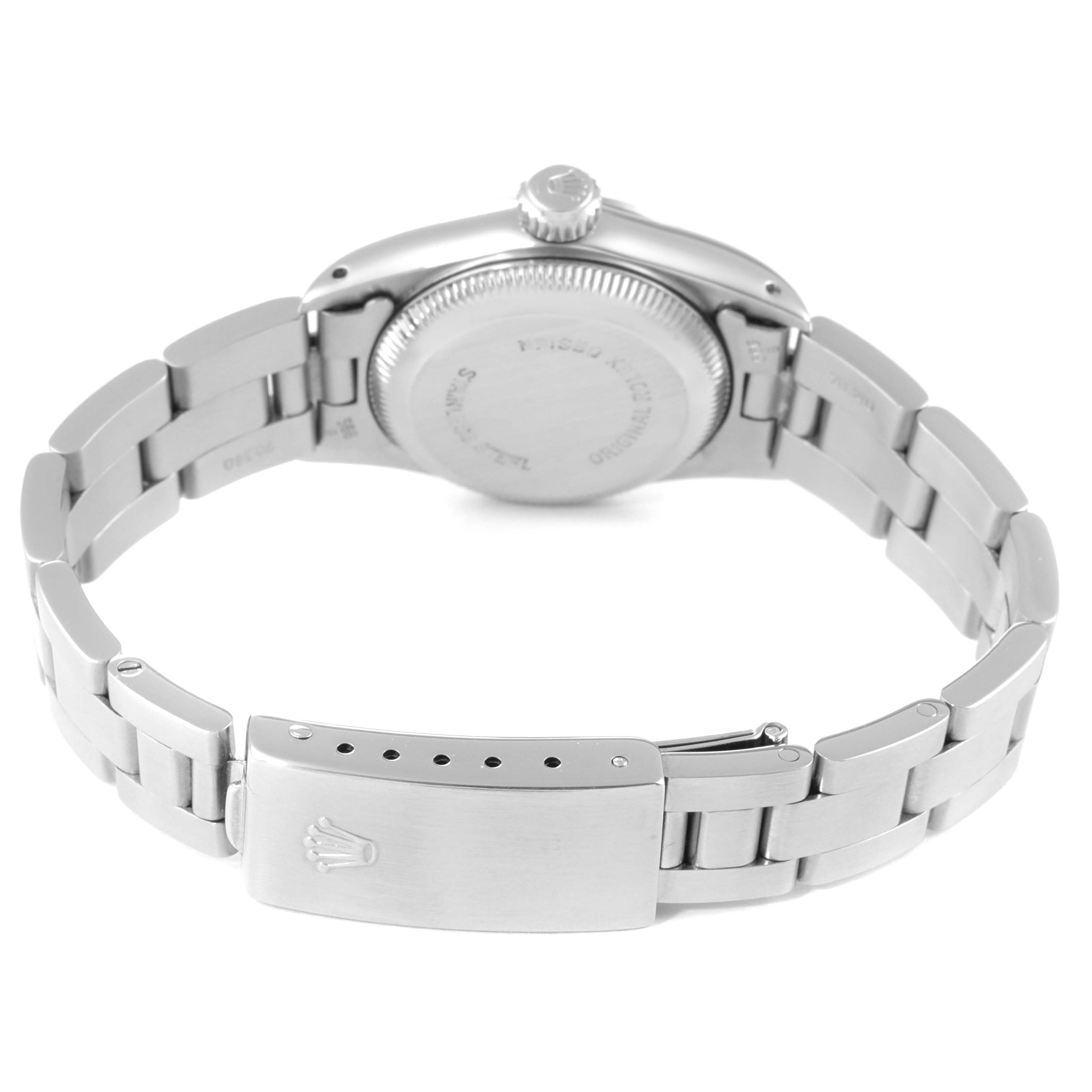 The image shows the back view of a Rolex Oyster Perpetual 67230 Women's Stainless Steel Silver Dial 67230 Women's Stainless Steel Silver Dial watch, highlighting its clasp, bracelet, and case back.