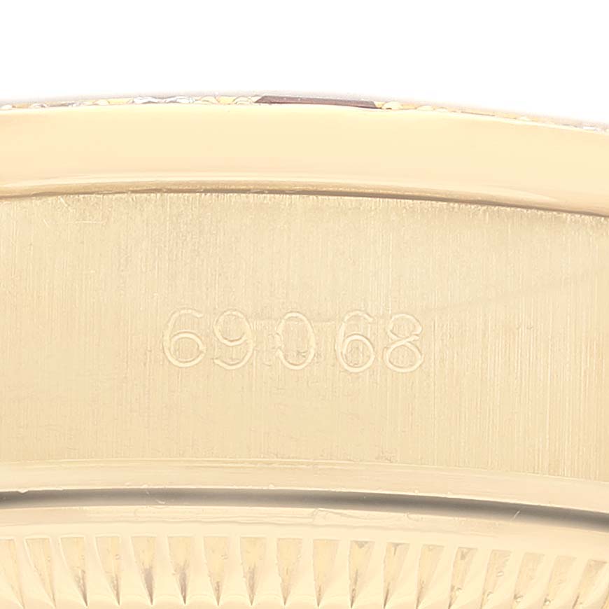 This image shows the engraved model number 69068 on the case back of a Rolex President 69068 Women's Yellow Gold Champagne Dial 69068 Women's Yellow Gold Champagne Dial watch.