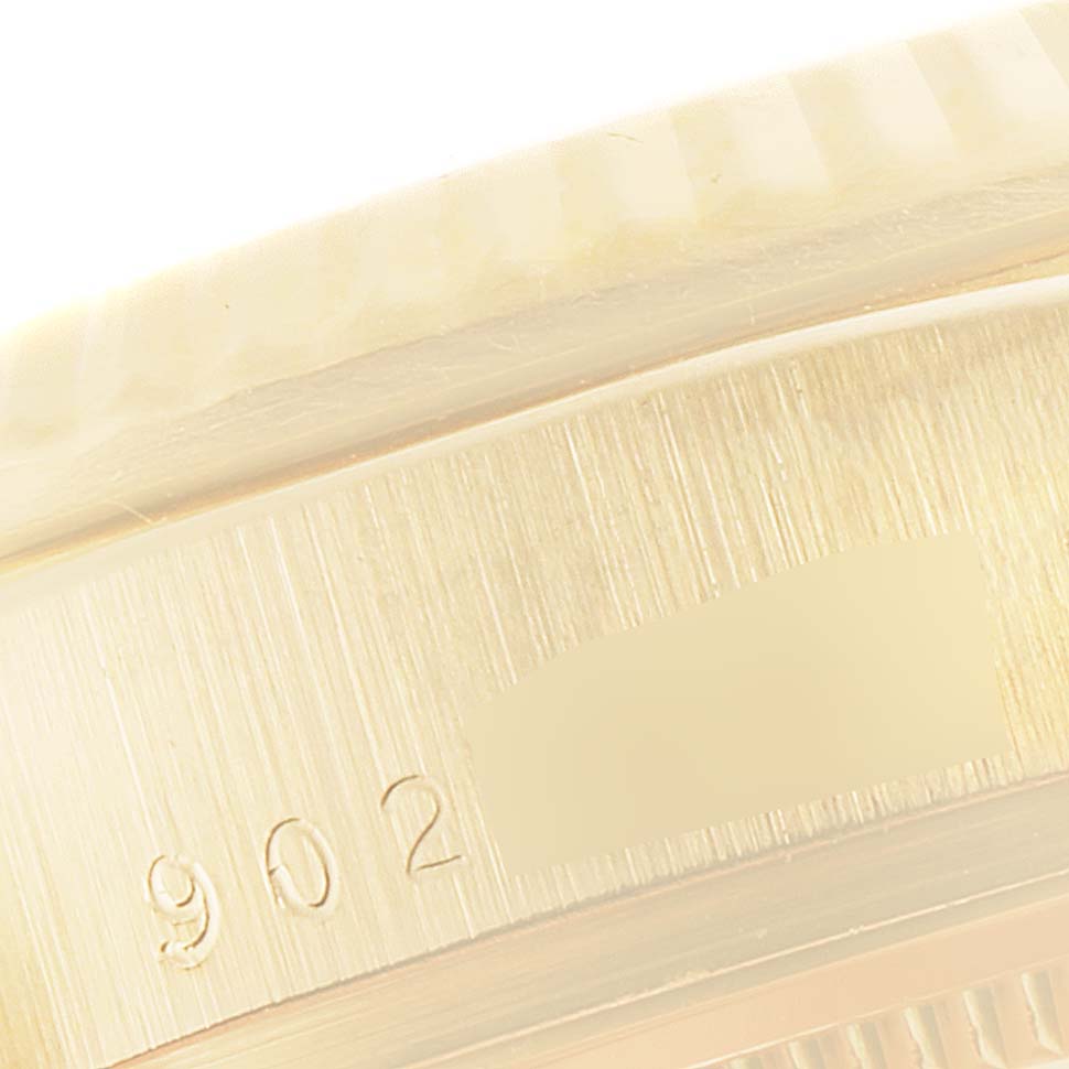 This image shows a close-up angle of the casing edge of a Rolex President 18078 Men
s Yellow Gold Black Dial 18078 Men
s Yellow Gold Black Dial model watch, highlighting some engraved numbers.
