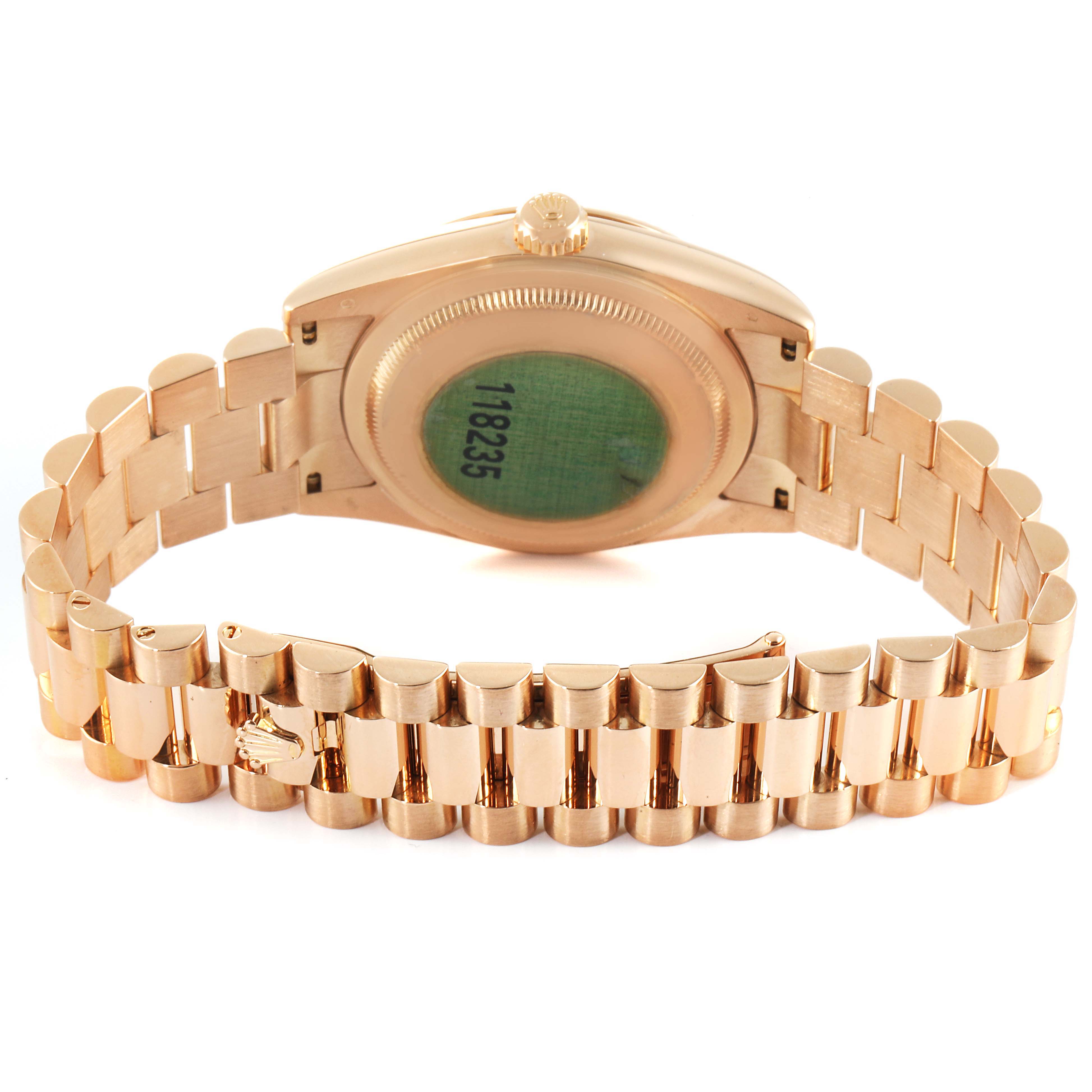 The image shows the backside and bracelet of a Rolex President 118235 Men's Rose Gold Mother of Pearl Dial 118235 Men's Rose Gold Mother of Pearl Dial model watch, highlighting its serial number and gold links.