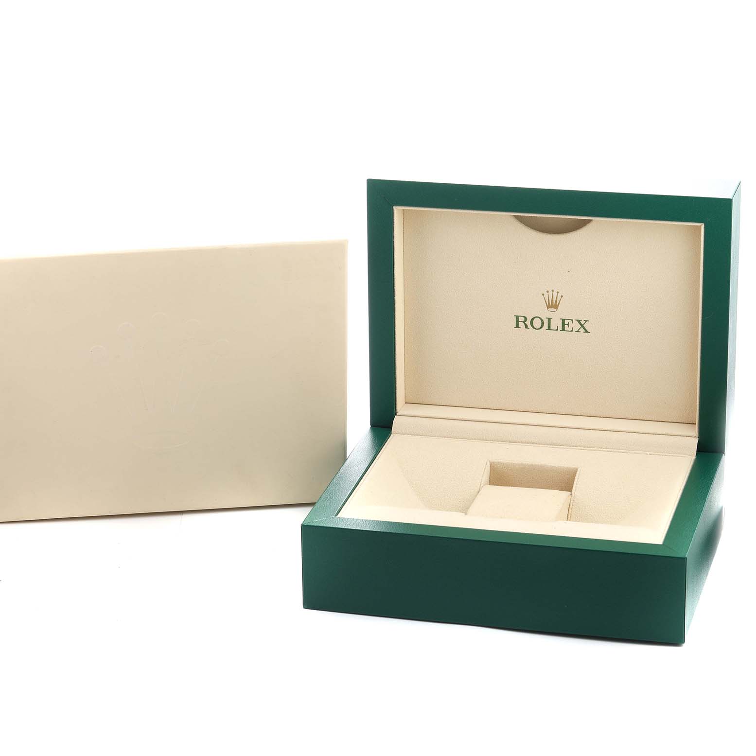 The image shows an open Rolex box for the President model, featuring the interior logo and watch cushion area.