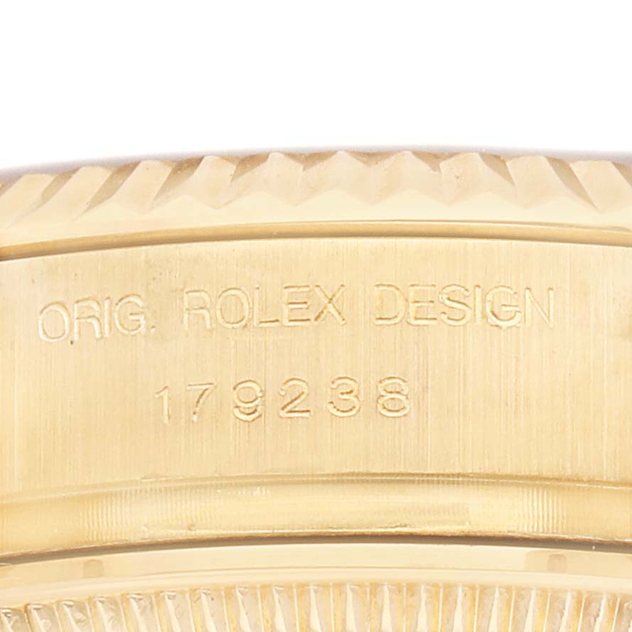 The image shows the side of a Rolex President 179238 Women's Yellow Gold Mother of Pearl Dial model watch, focusing on the engraved design and model number.