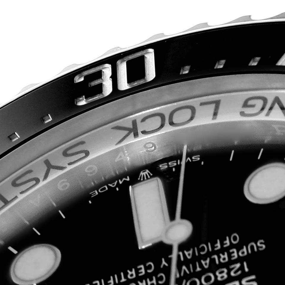This close-up image of the Rolex Sea-Dweller 126660 Men's Stainless Steel Blue Dial 126660 Men's Stainless Steel Blue Dial watch shows part of the bezel with the number 30 and a portion of the watch dial.