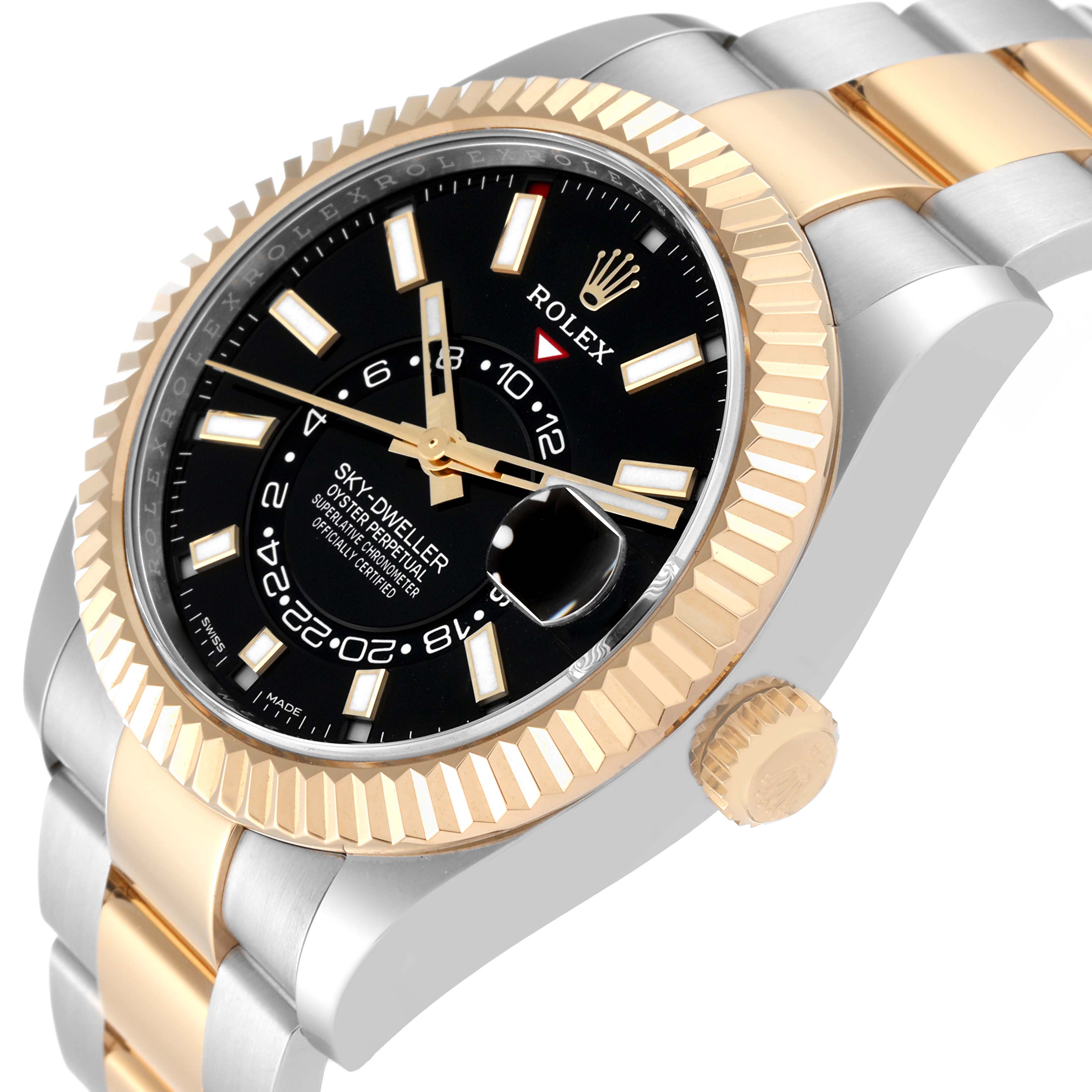 The image shows a side-view angle of a Rolex Sky-Dweller 326933 Men
s Steel and Gold (two tone) Black Dial 326933 Men
s Steel and Gold (two tone) Black Dial watch highlighting the bezel, crown, dial, and part of the bracelet.