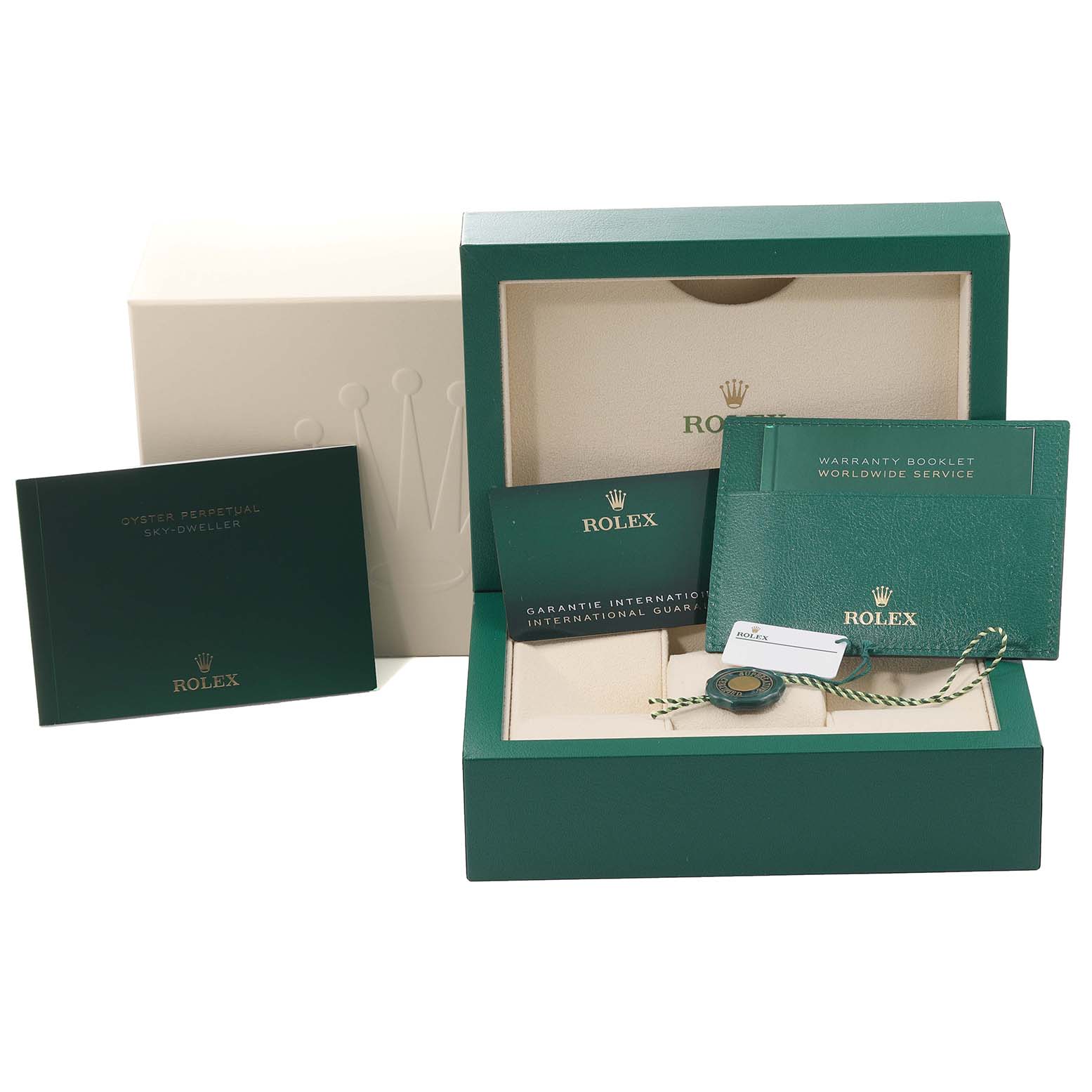 The image shows the packaging, warranty booklets, and tags for a Rolex Sky-Dweller 326933 Men
s Steel and Gold (two tone) Black Dial 326933 Men
s Steel and Gold (two tone) Black Dial watch.