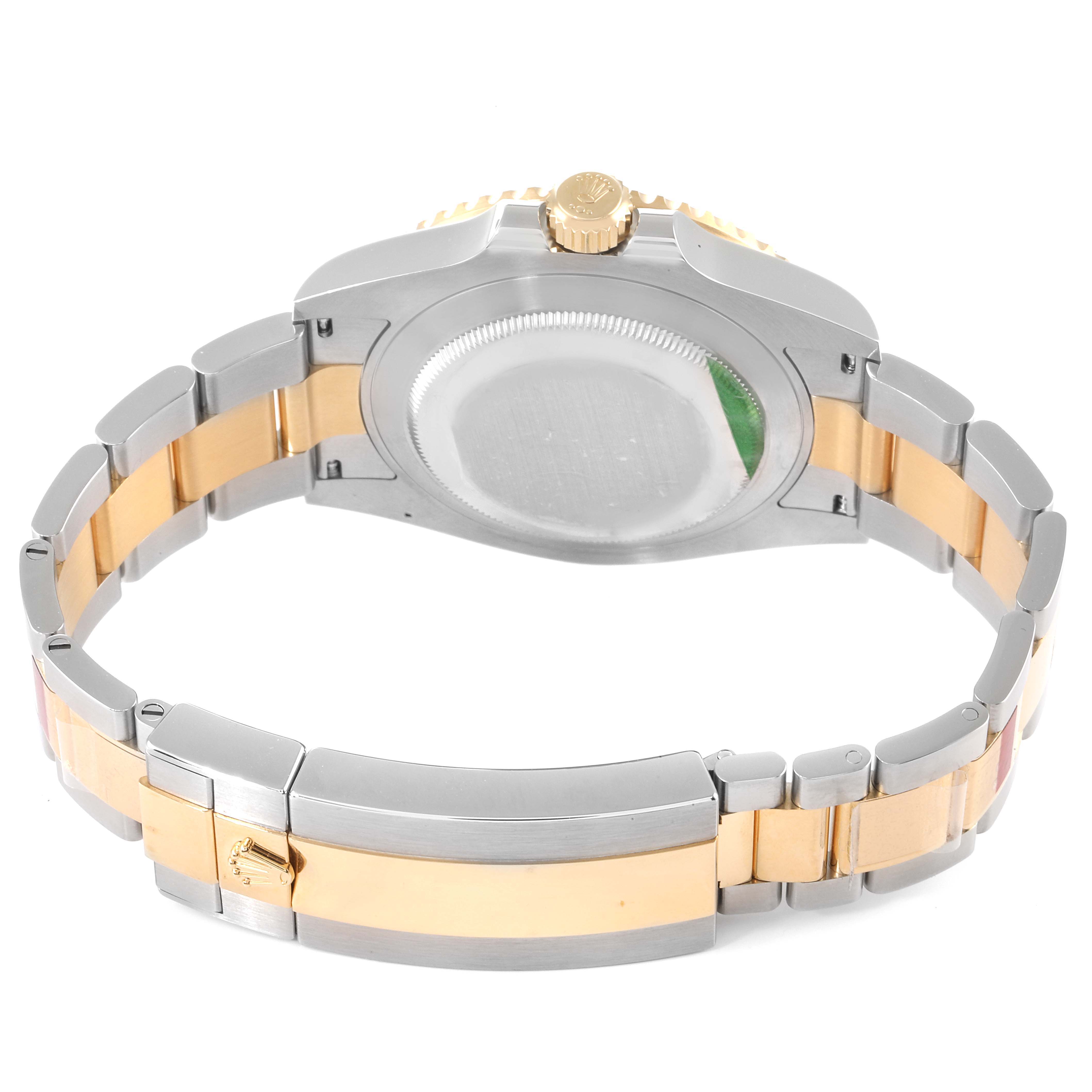 The image shows the back case, crown, and bracelet of a Rolex Submariner 126613 Men's Steel and Gold (two tone) Black Dial 126613 Men's Steel and Gold (two tone) Black Dial watch, viewed from behind.