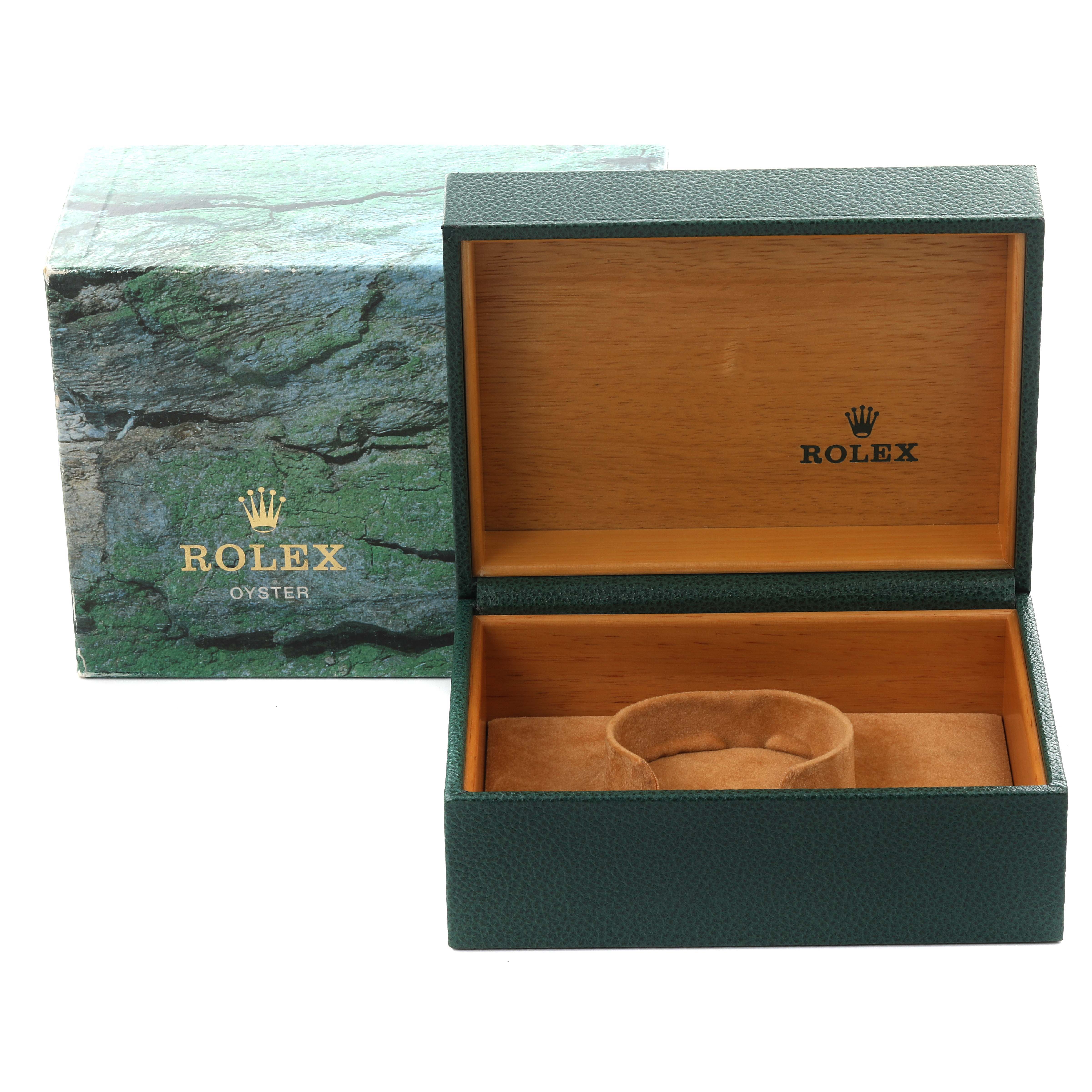 The image shows a Rolex Submariner 16613 Men's Steel and Gold (two tone) Blue Dial 16613 Men's Steel and Gold (two tone) Blue Dial watch box and packaging at an angle, highlighting the box's interior and exterior design.