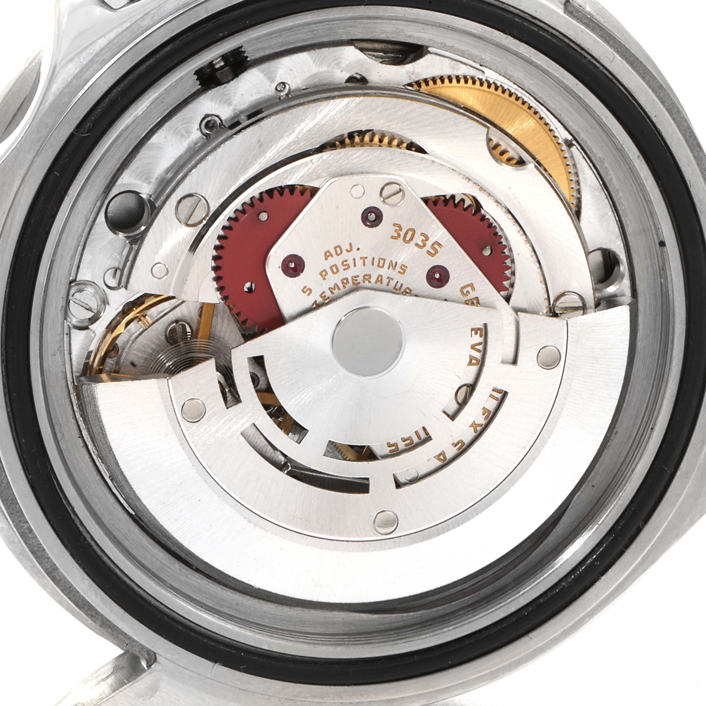 The image shows a close-up of the movement and inner mechanism of a Vintage Collection model by Rolex.