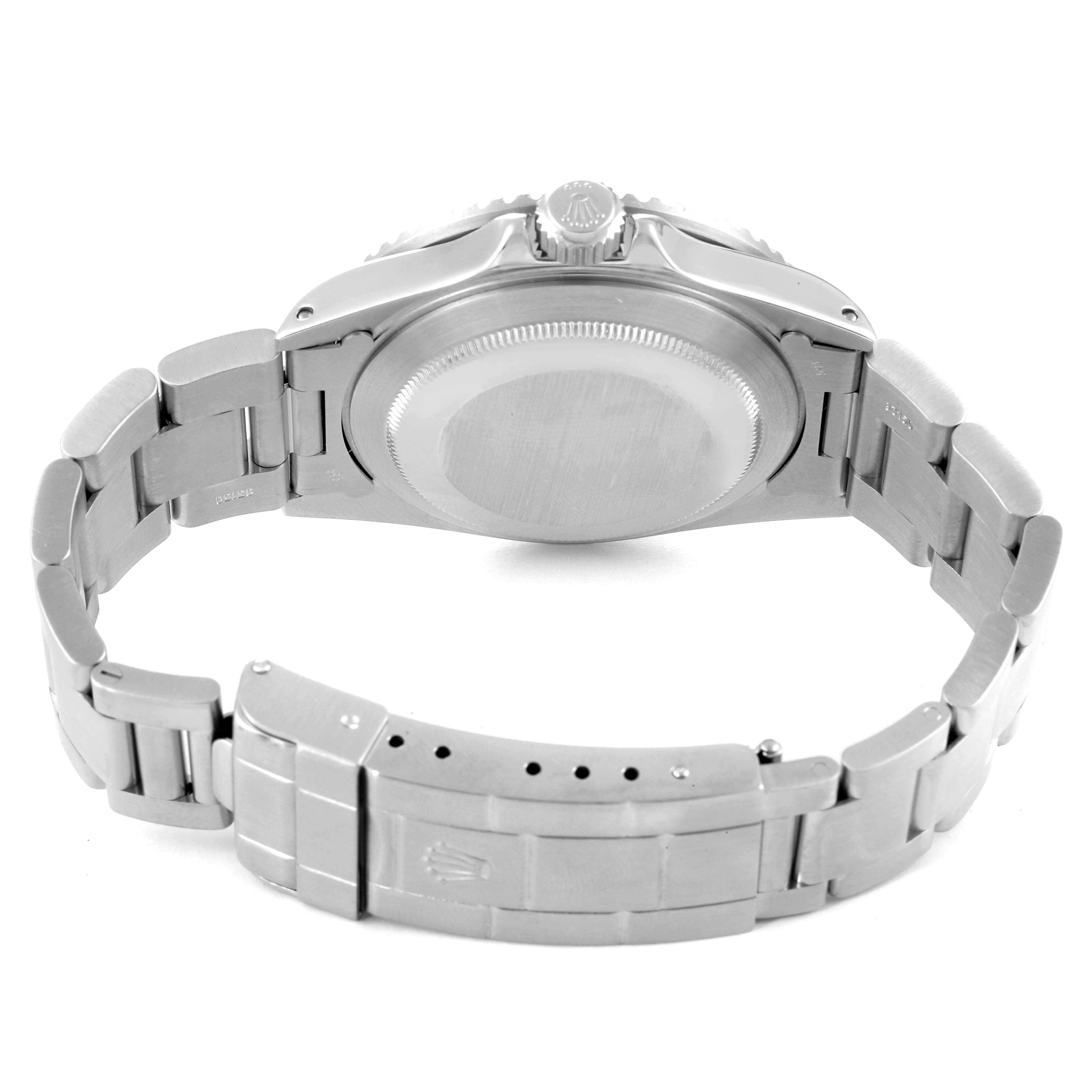 The image shows the back view of a Vintage Collection Rolex watch, focusing on the case back and metal bracelet with the clasp open.