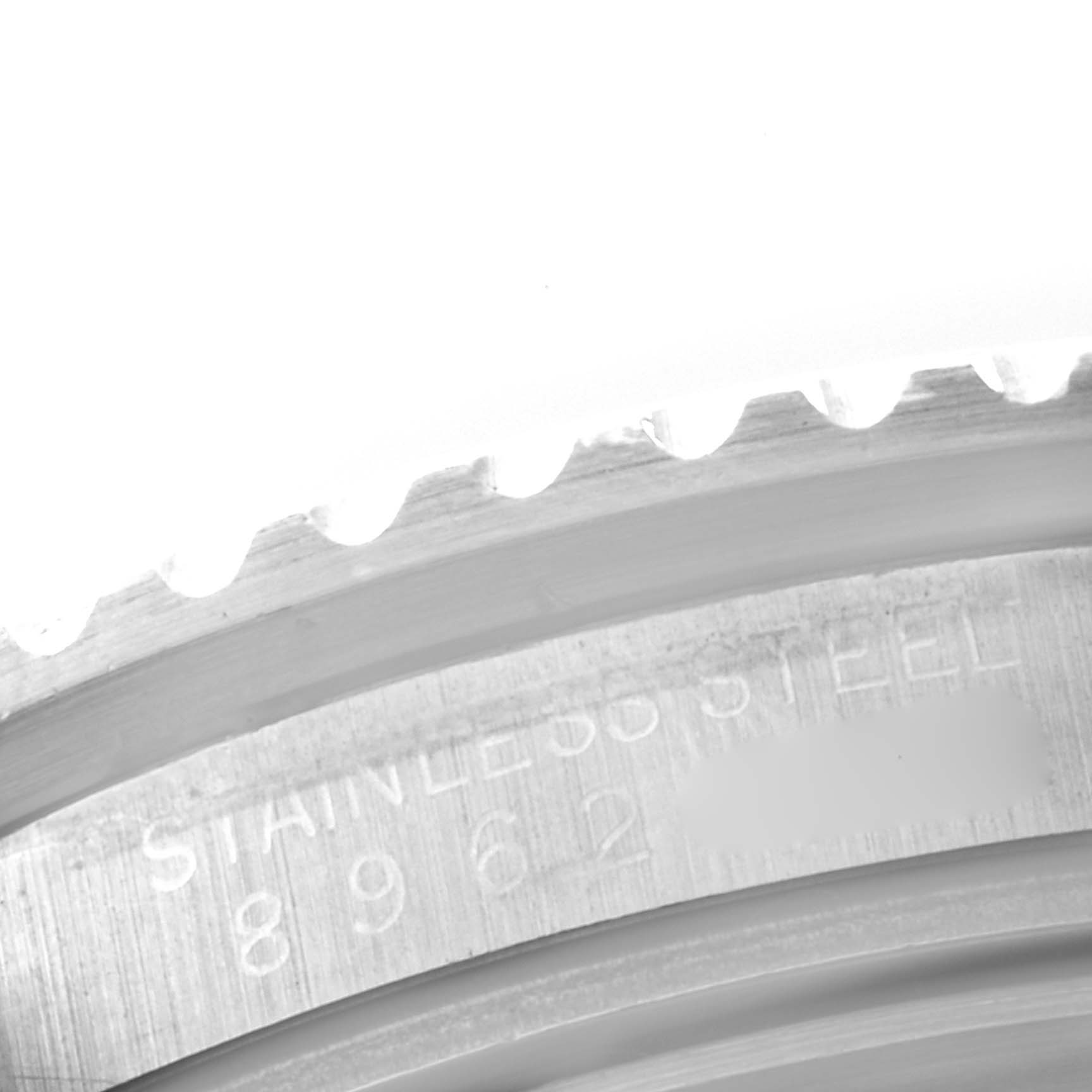 This is a close-up angle showing the engraved edge and part of the bezel of the Rolex Vintage Collection 16800 Men's Stainless Steel Black Dial 16800 Men's Stainless Steel Black Dial model watch, highlighting the stainless steel material.