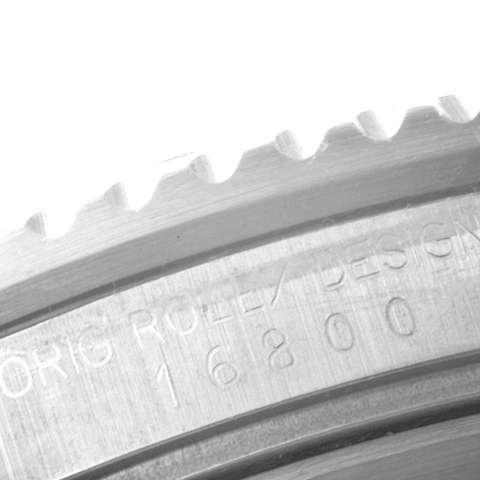 This close-up image shows the edge and part of the engraved case back of the Rolex Vintage Collection 16800 Men's Stainless Steel Black Dial 16800 Men's Stainless Steel Black Dial model.