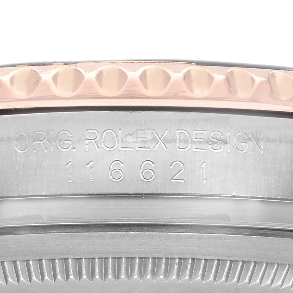The image shows a close-up of the Rolex Yacht-Master 116621 Men's Steel and Gold (two tone) Brown Dial's side, highlighting the bezel and engraved model number.