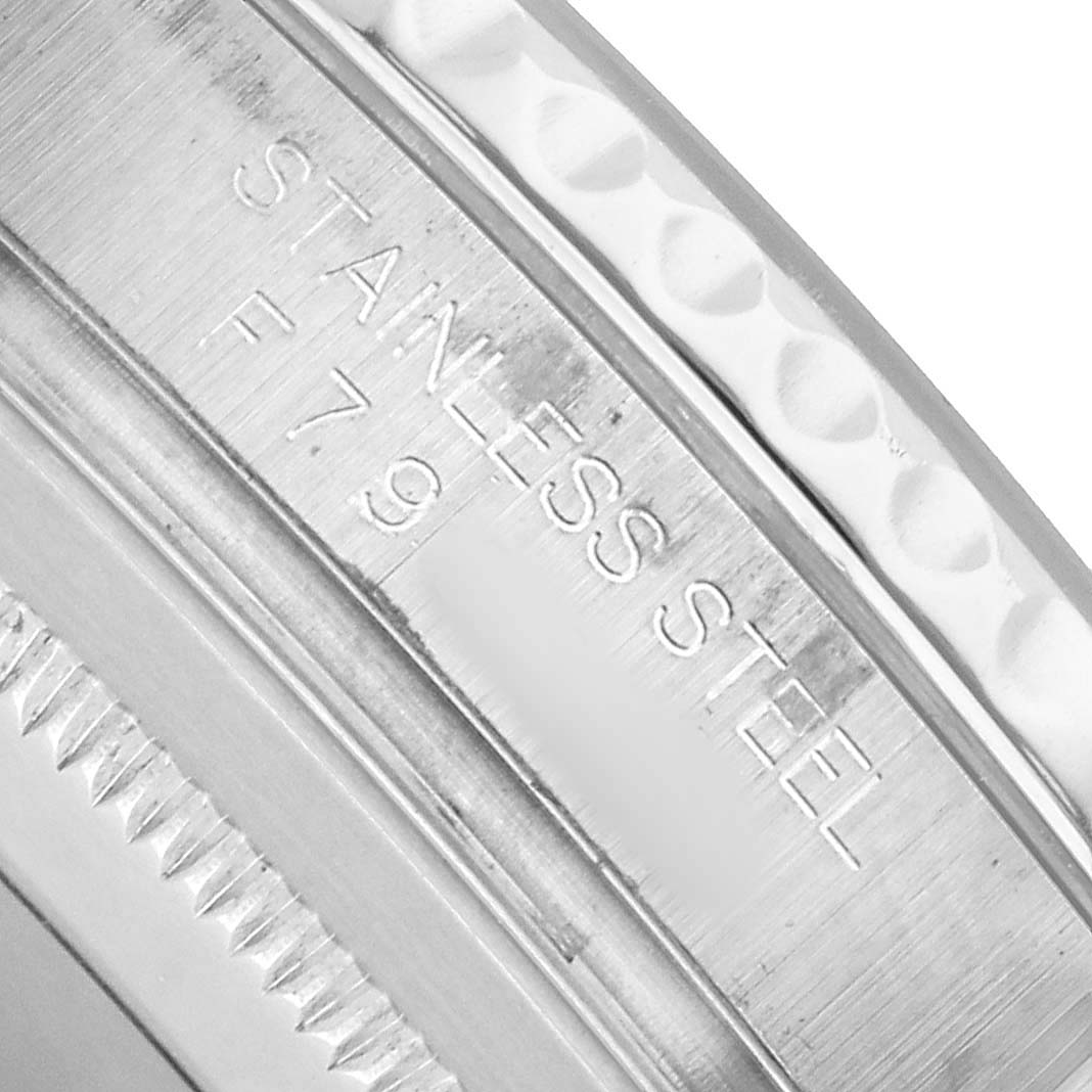 The image shows a close-up of the stainless steel bezel and engravings on the Rolex Yacht-Master 16622 Men's Stainless Steel Silver Dial watch.
