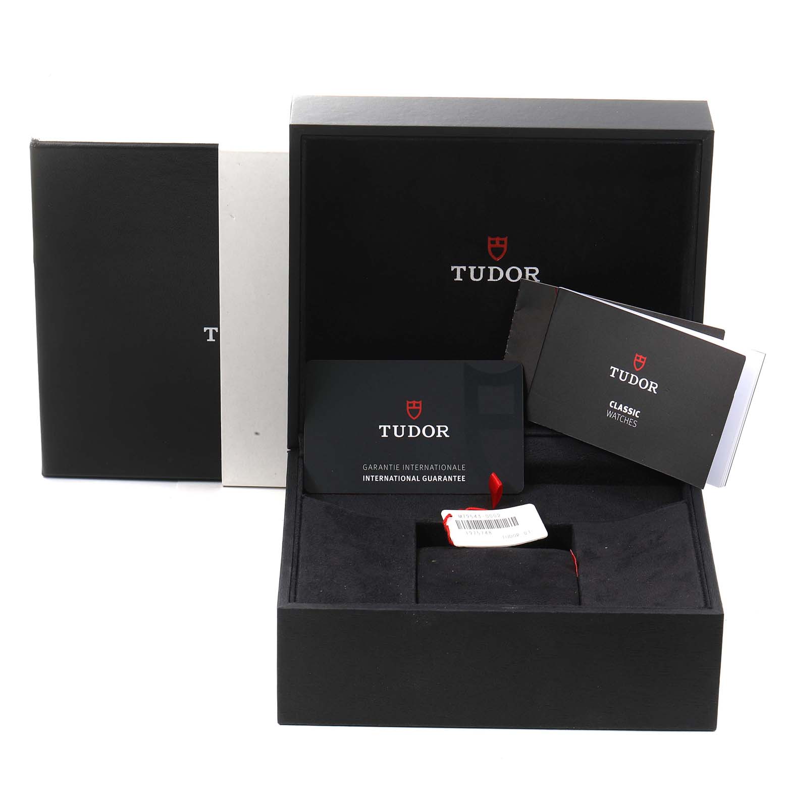 The image shows the packaging and accessories for the Tudor Heritage Black Bay 79543 Men's Steel and Gold (two tone) Champagne Dial 79543 Men's Steel and Gold (two tone) Champagne Dial watch including the guarantee card and manual.
