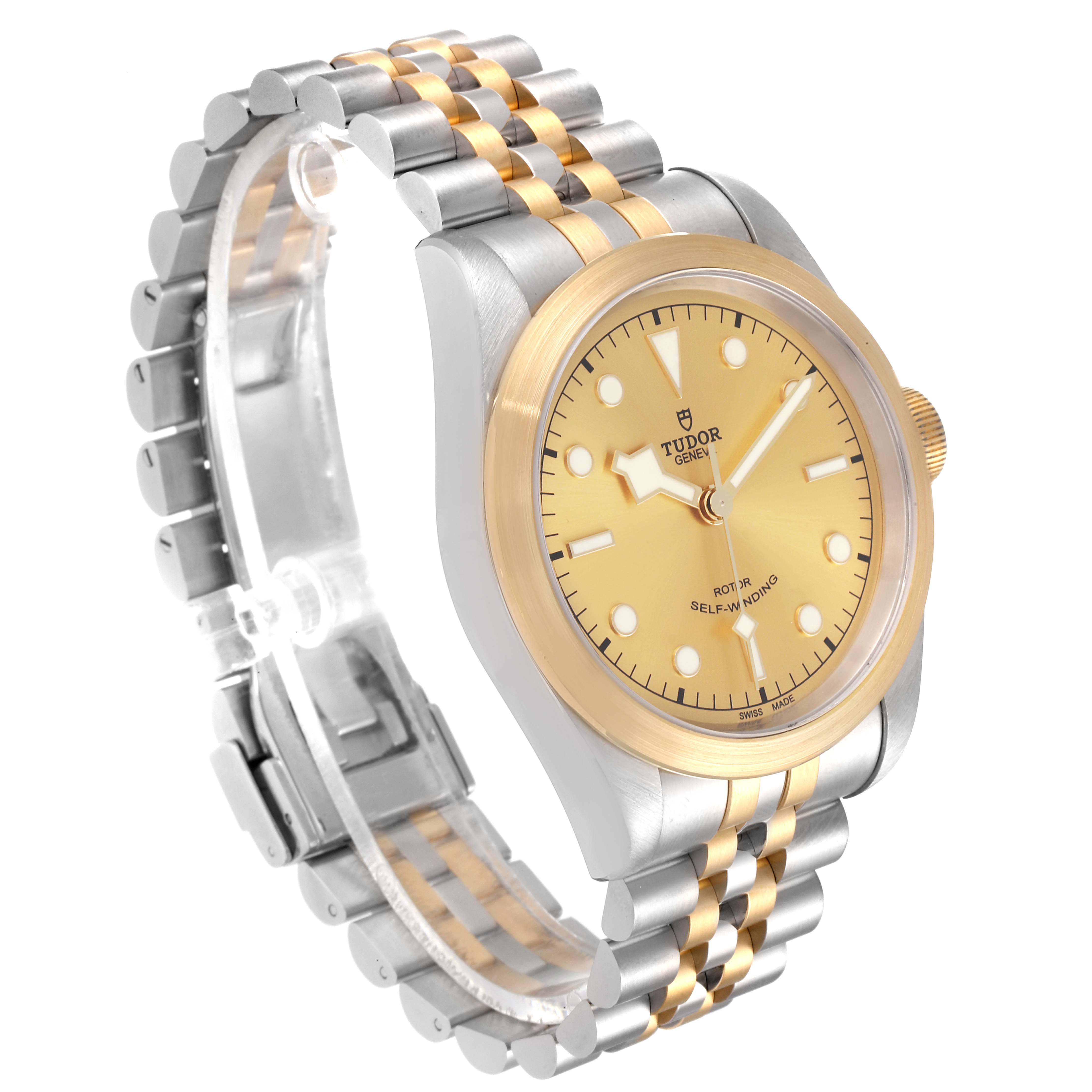 The image shows a three-quarter view of the Tudor Heritage Black Bay 79543 Men's Steel and Gold (two tone) Champagne Dial 79543 Men's Steel and Gold (two tone) Champagne Dial watch, highlighting its gold dial, bezel, and two-tone bracelet.