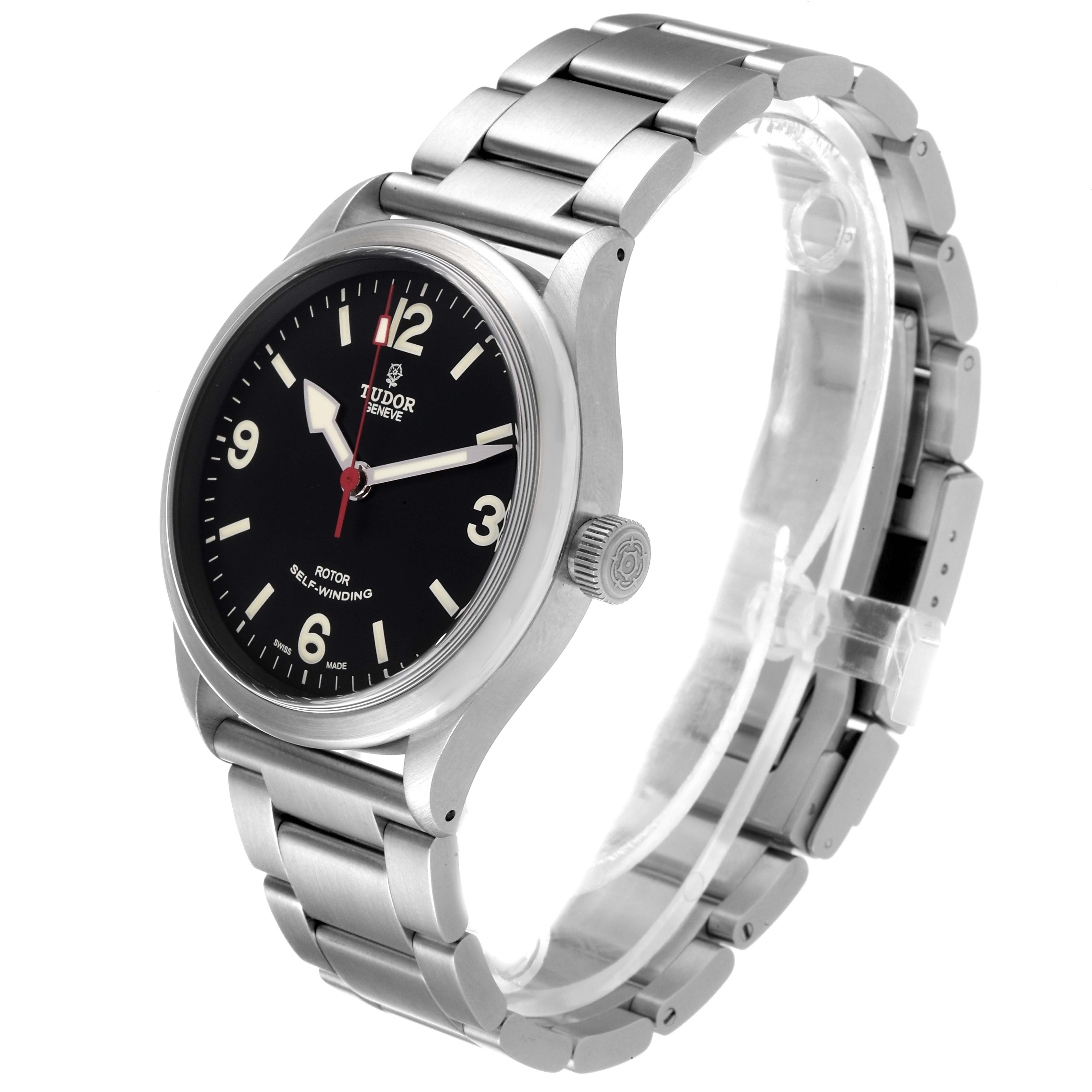 The Tudor Heritage Ranger 79910 Men's Stainless Steel Black Dial 79910 Men's Stainless Steel Black Dial watch is shown from a 3/4 angle, displaying its face, crown, and metal bracelet.