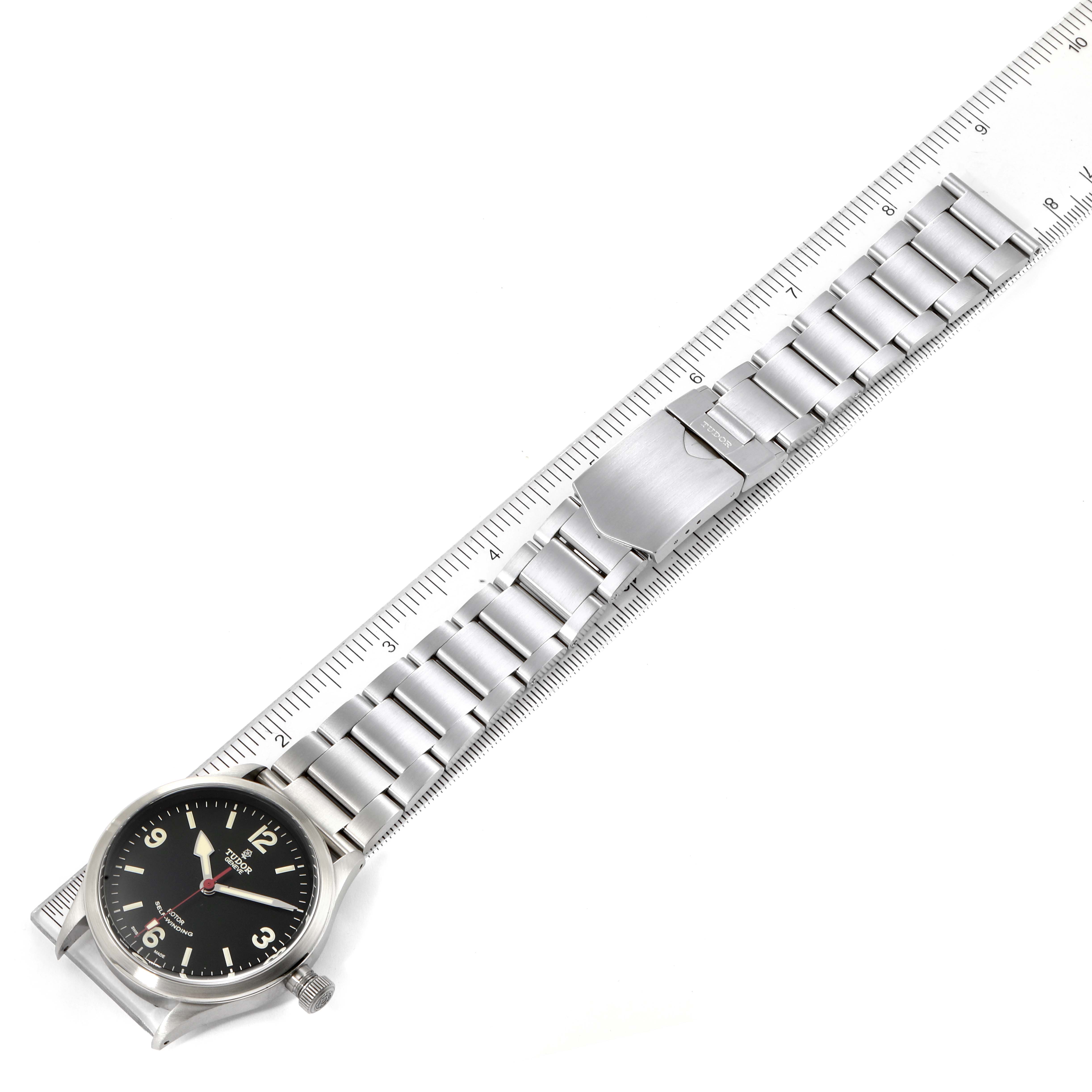 The Tudor Heritage Ranger 79910 Men's Stainless Steel Black Dial 79910 Men's Stainless Steel Black Dial watch is shown from a top-down angle, displaying its full length and the front of its dial and bracelet.
