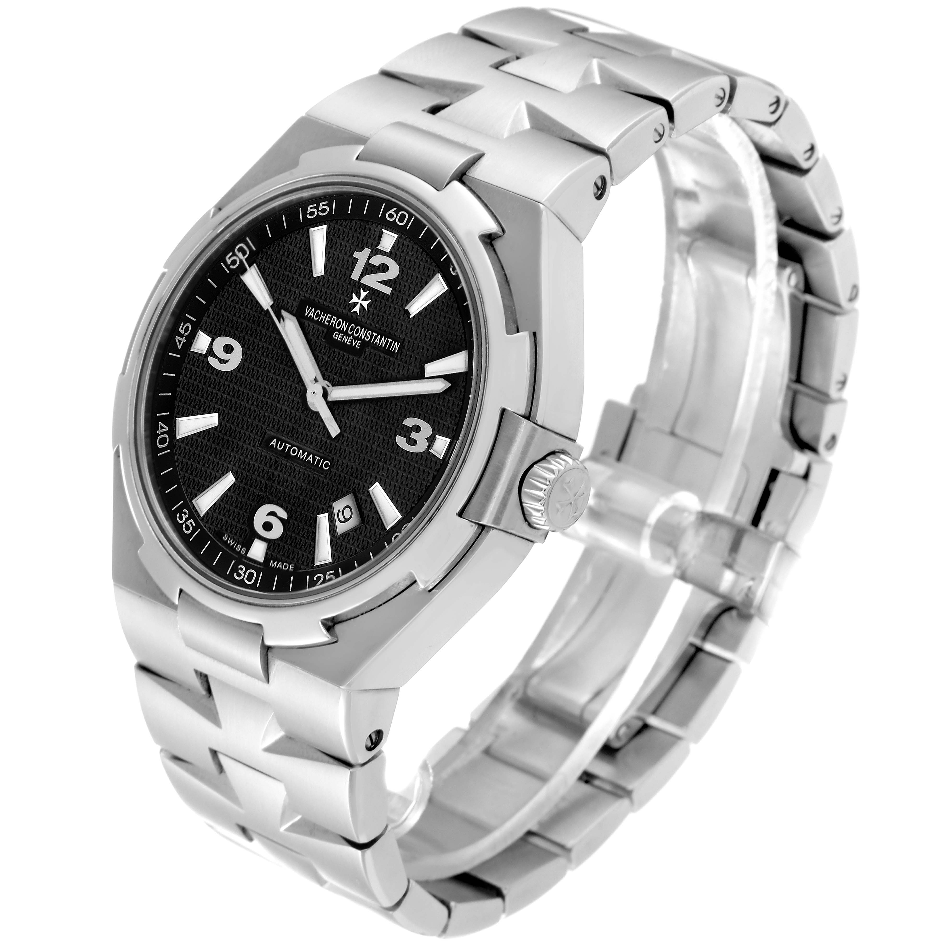 The Vacheron Constantin Overseas 47040/B01A-9094 Men's Stainless Steel Black Dial 47040/B01A-9094 Men's Stainless Steel Black Dial watch is shown at an angle displaying the dial, bezel, crown, and metal bracelet.