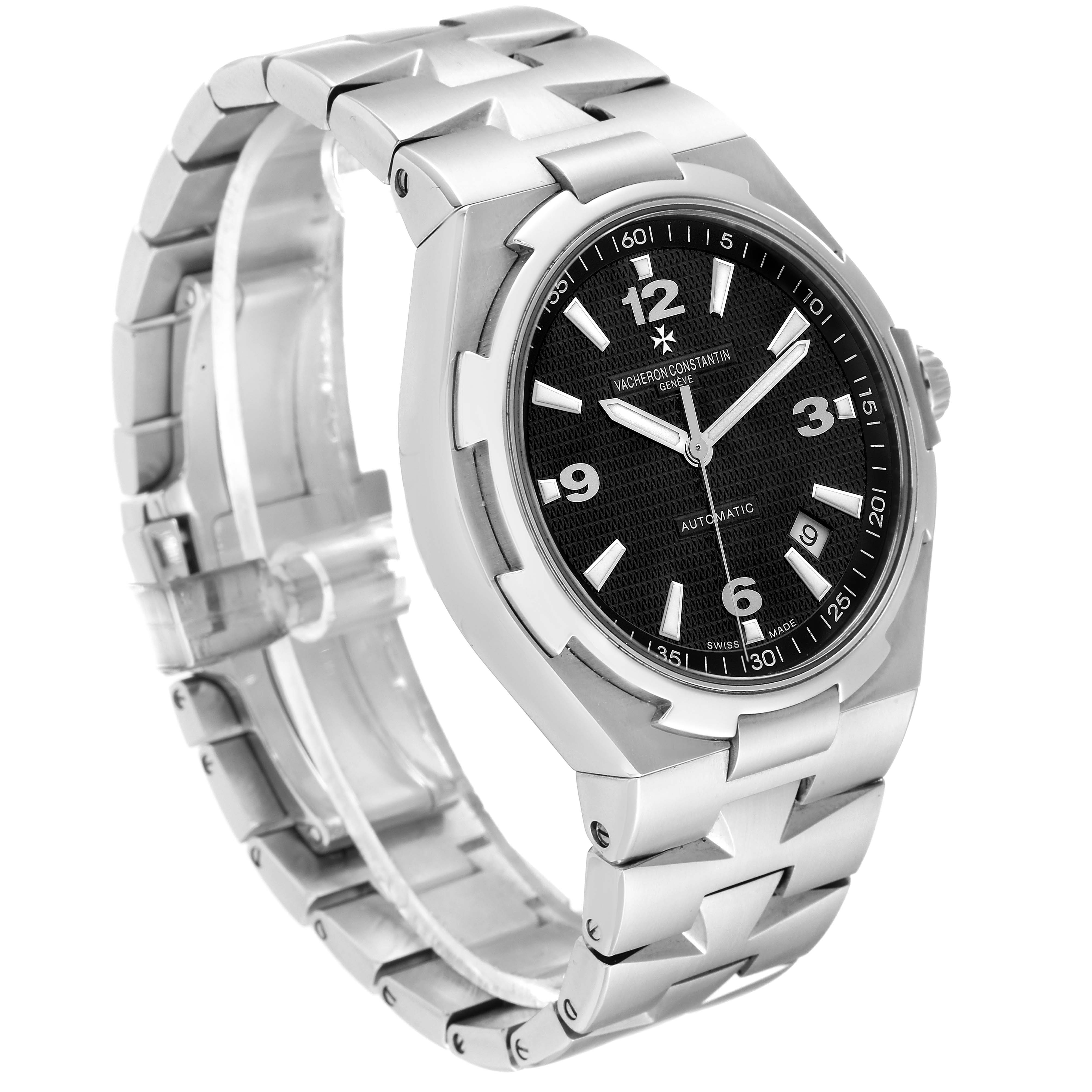 The Vacheron Constantin Overseas 47040/B01A-9094 Men's Stainless Steel Black Dial 47040/B01A-9094 Men's Stainless Steel Black Dial watch is shown at a three-quarter angle, highlighting the black dial, stainless steel case, and bracelet.