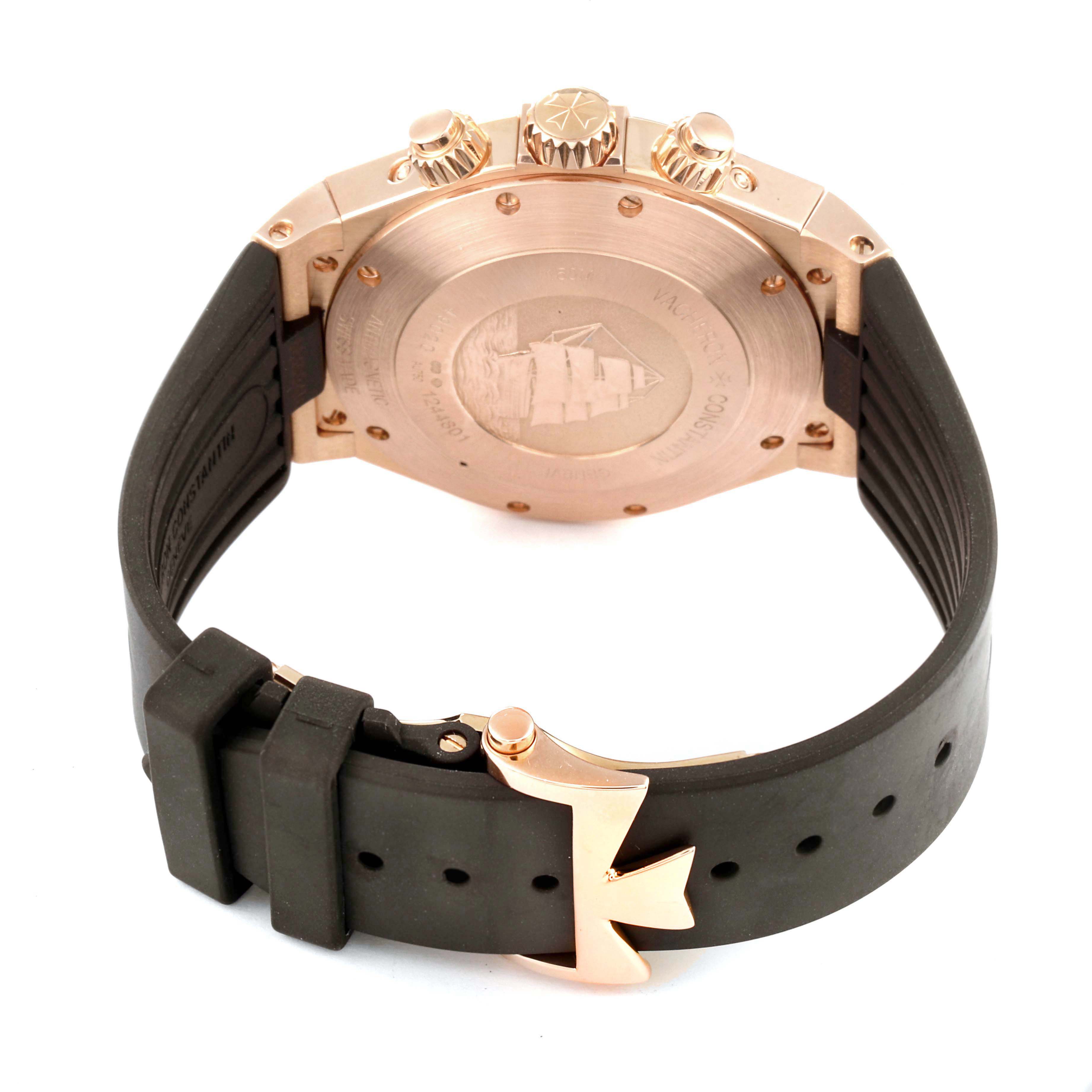 The image shows the back view of a Vacheron Constantin Overseas 49020/000R-9753 Men's Rose Gold Brown Dial 49020/000R-9753 Men's Rose Gold Brown Dial watch, highlighting its case back, crown, and clasp.