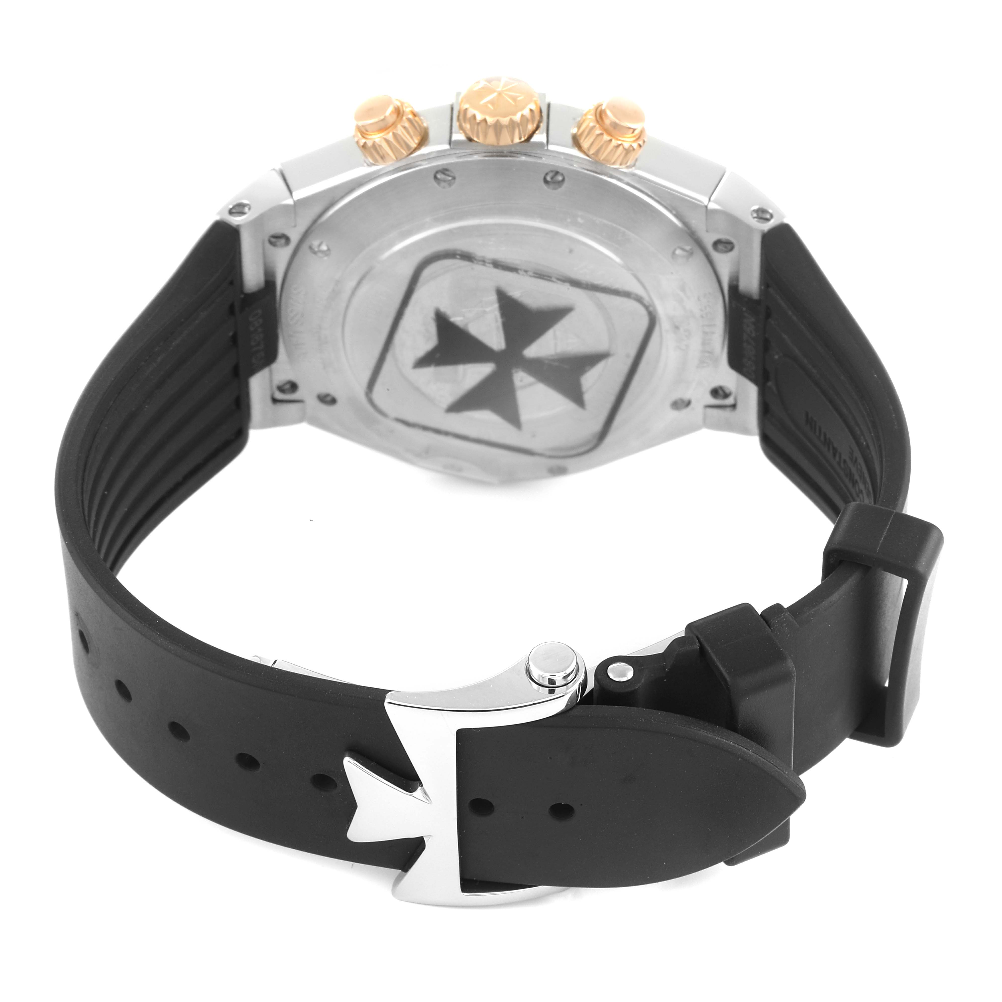 The image shows the back case and black rubber strap of a Vacheron Constantin Overseas 49150/000M-9338 Men's Steel and Gold (two tone) Grey Dial 49150/000M-9338 Men's Steel and Gold (two tone) Grey Dial watch, including the clasp and crown.