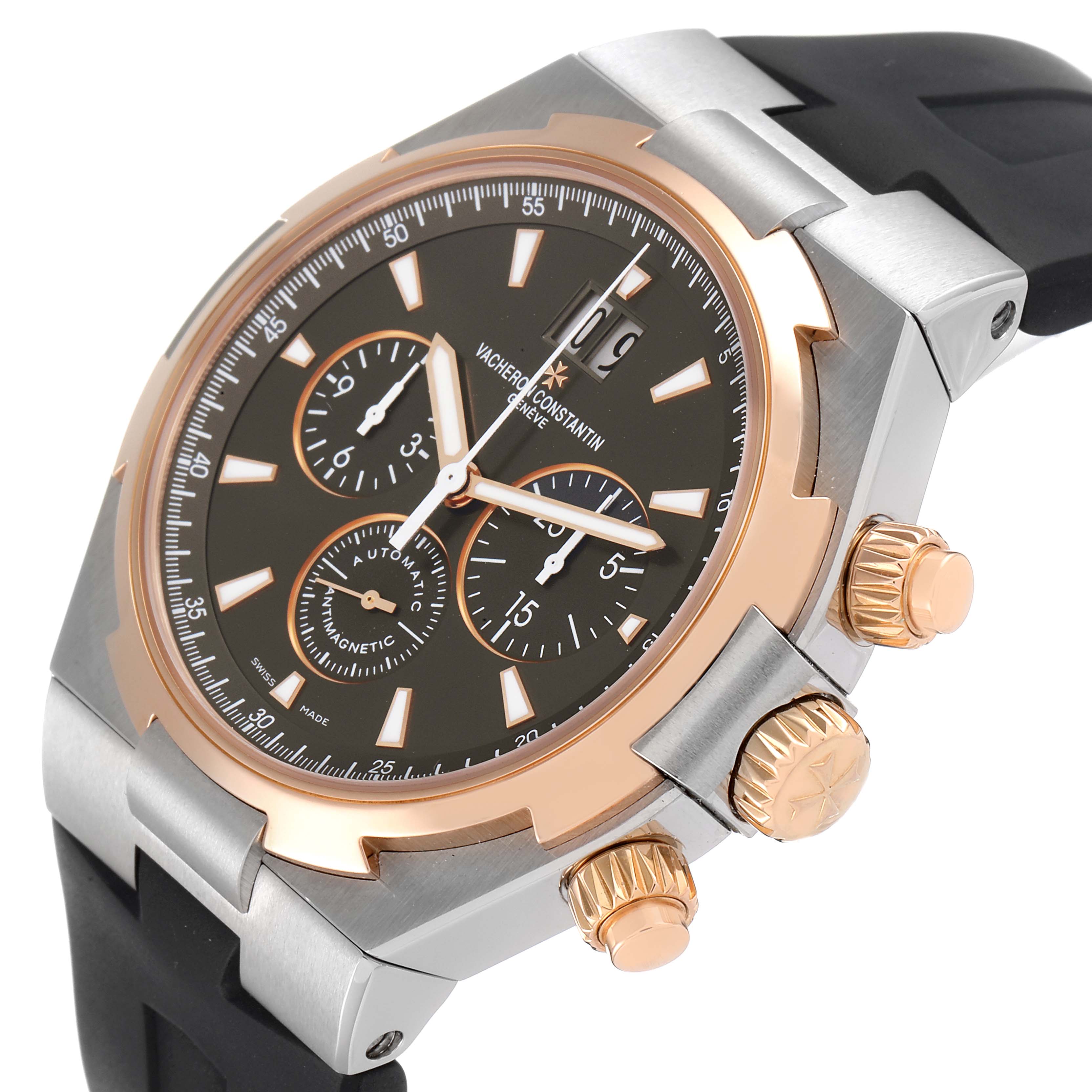 The image shows a close-up of the Vacheron Constantin Overseas 49150/000M-9338 Men's Steel and Gold (two tone) Grey Dial 49150/000M-9338 Men's Steel and Gold (two tone) Grey Dial watch, highlighting its face, bezel, and crown at an oblique angle.