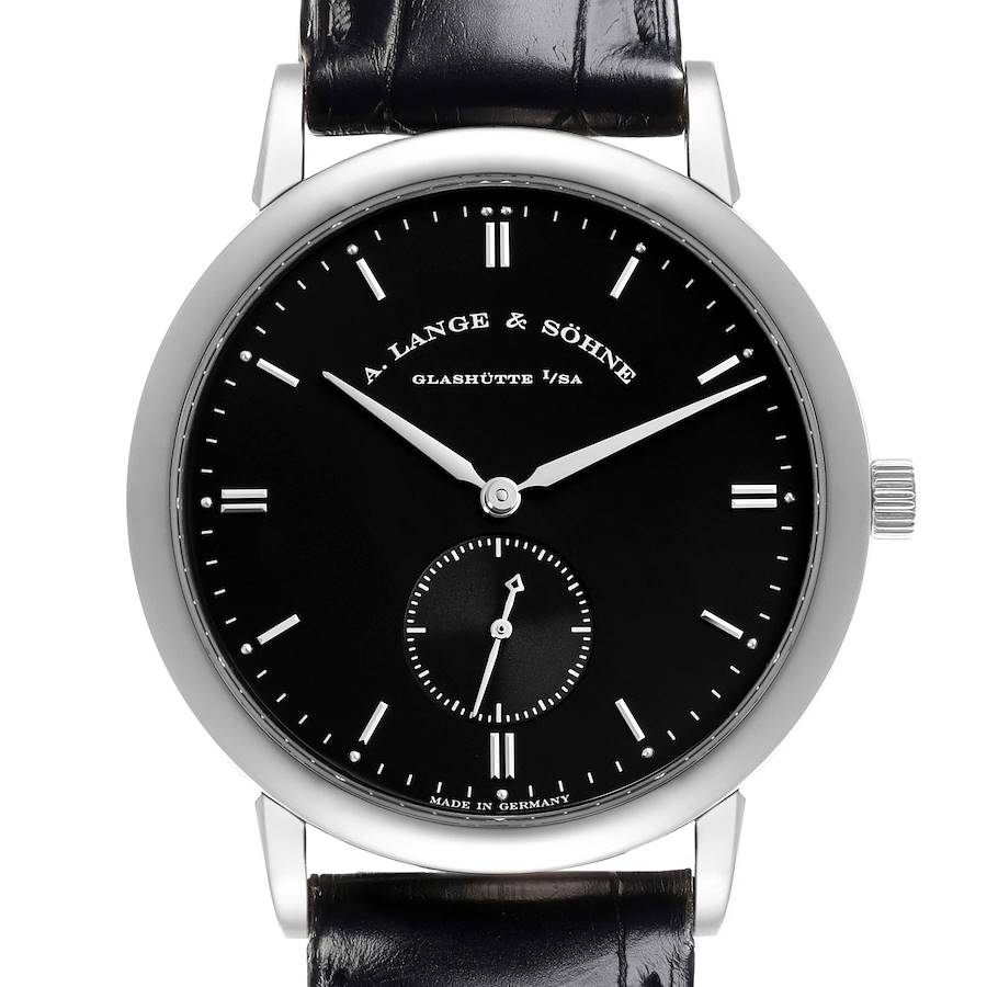 The A. Lange & Söhne Saxonia watch is shown from a front angle, featuring its black dial, silver hands, and leather strap.