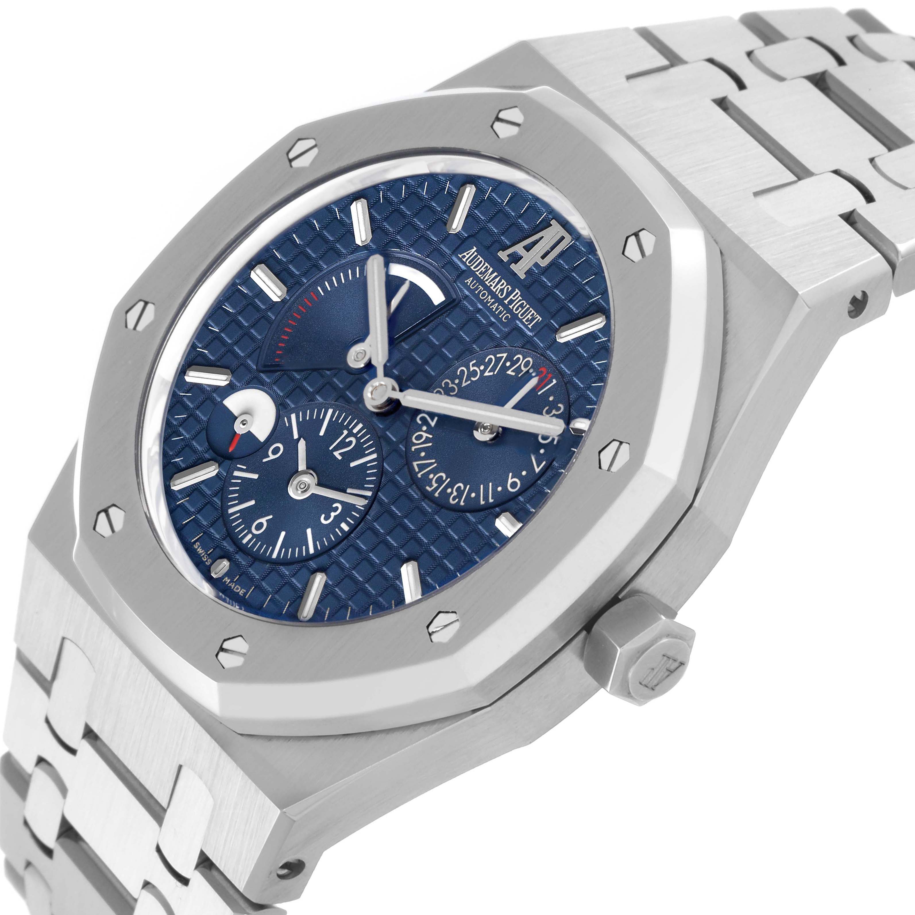 The Audemars Piguet Royal Oak 26120ST.00.1220ST.02 Men's Stainless Steel Blue Dial watch is shown at an angle highlighting its blue textured dial, bezel, crown, and bracelet.