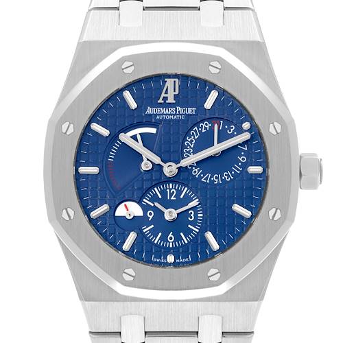 The Audemars Piguet Royal Oak watch is shown from the front, highlighting its blue dial, subdials, and octagonal bezel.