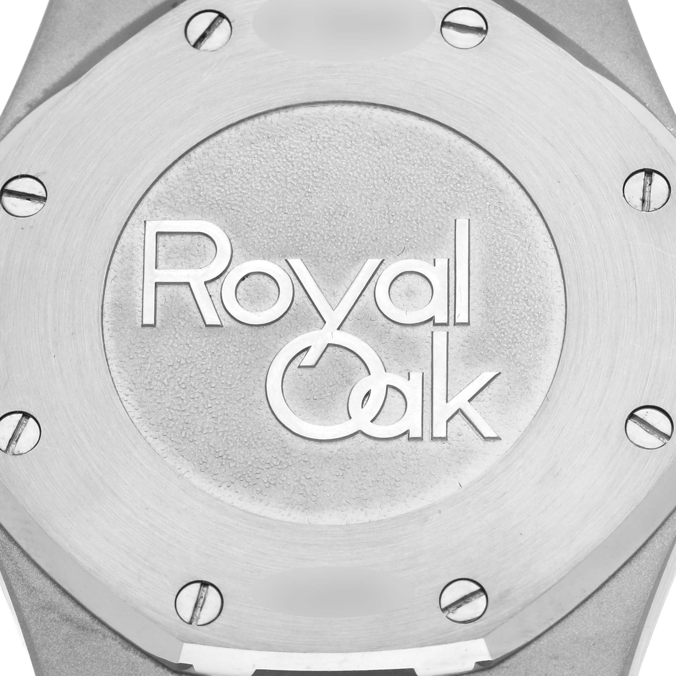 The image shows the case back of an Audemars Piguet Royal Oak 26120ST.00.1220ST.02 Men's Stainless Steel Blue Dial 26120ST.00.1220ST.02 Men's Stainless Steel Blue Dial watch, highlighting the logo and screws.